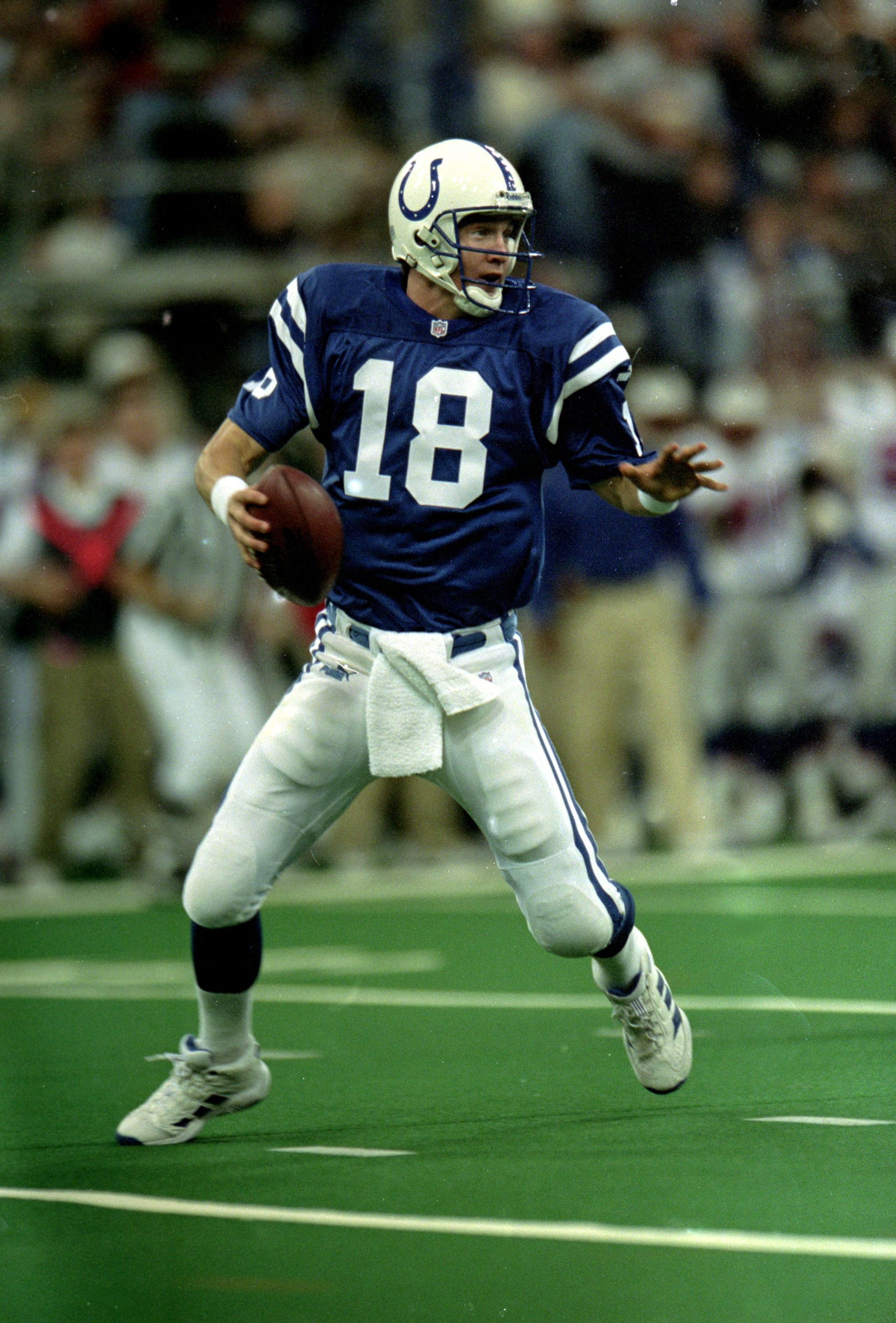 12 Dec 1999: Peyton Manning #18 of the Indianapolis Colts moves back to pass the ball during a game against the New England Patriots at the RCA Dome in Indianapolis, Indiana. The Colts defeated the Patriots 20-15. Mandatory Credit: Elsa Hasch  /Allsport