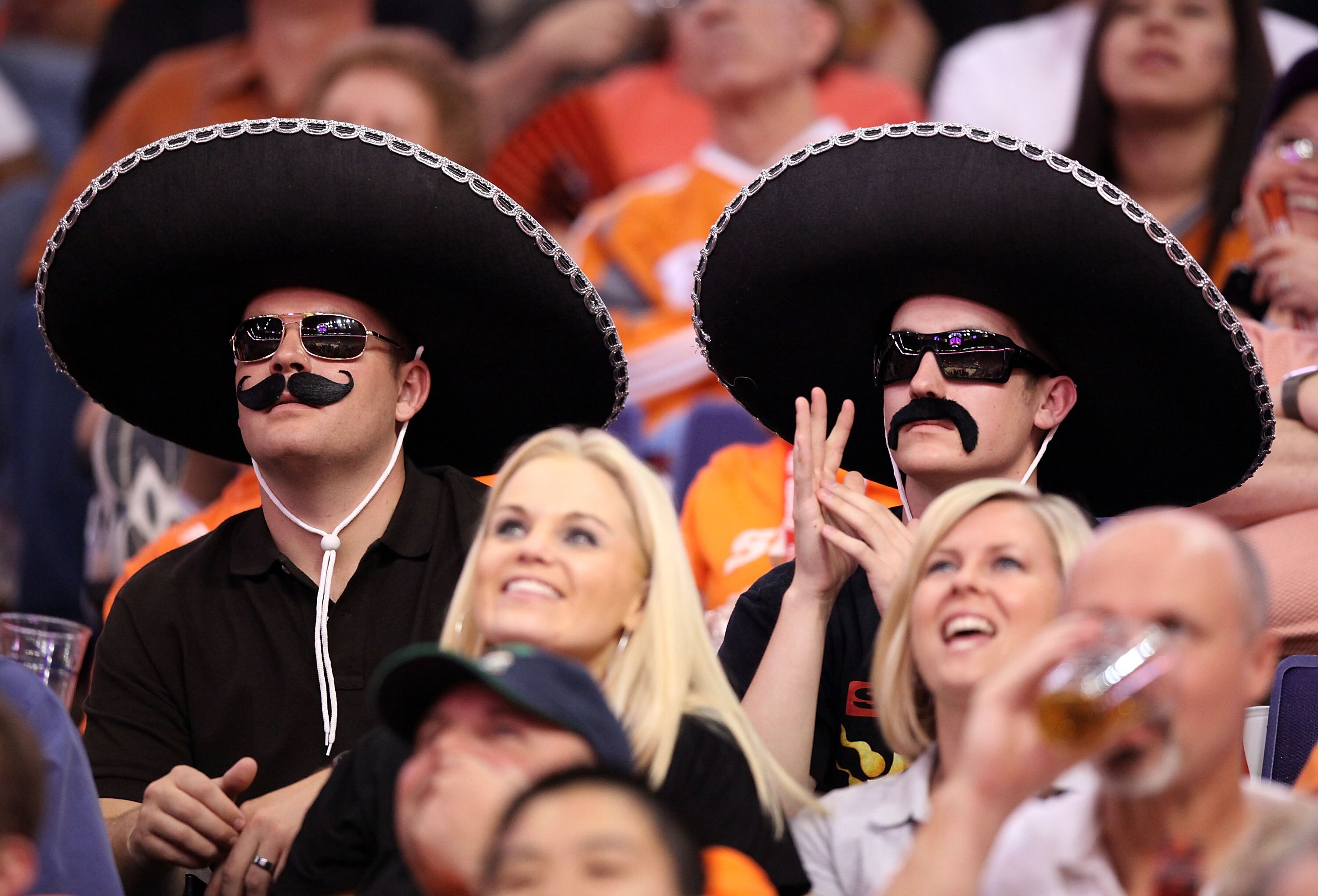 PHOENIX - MAY 05:  Fans wearing sombreros attend Game Two of the Western Conference Semifinals of the 2010 NBA Playoffs between the San Antonio Spurs and the Phoenix Suns at US Airways Center on May 5, 2010 in Phoenix, Arizona. The team is wearing 'Los Su