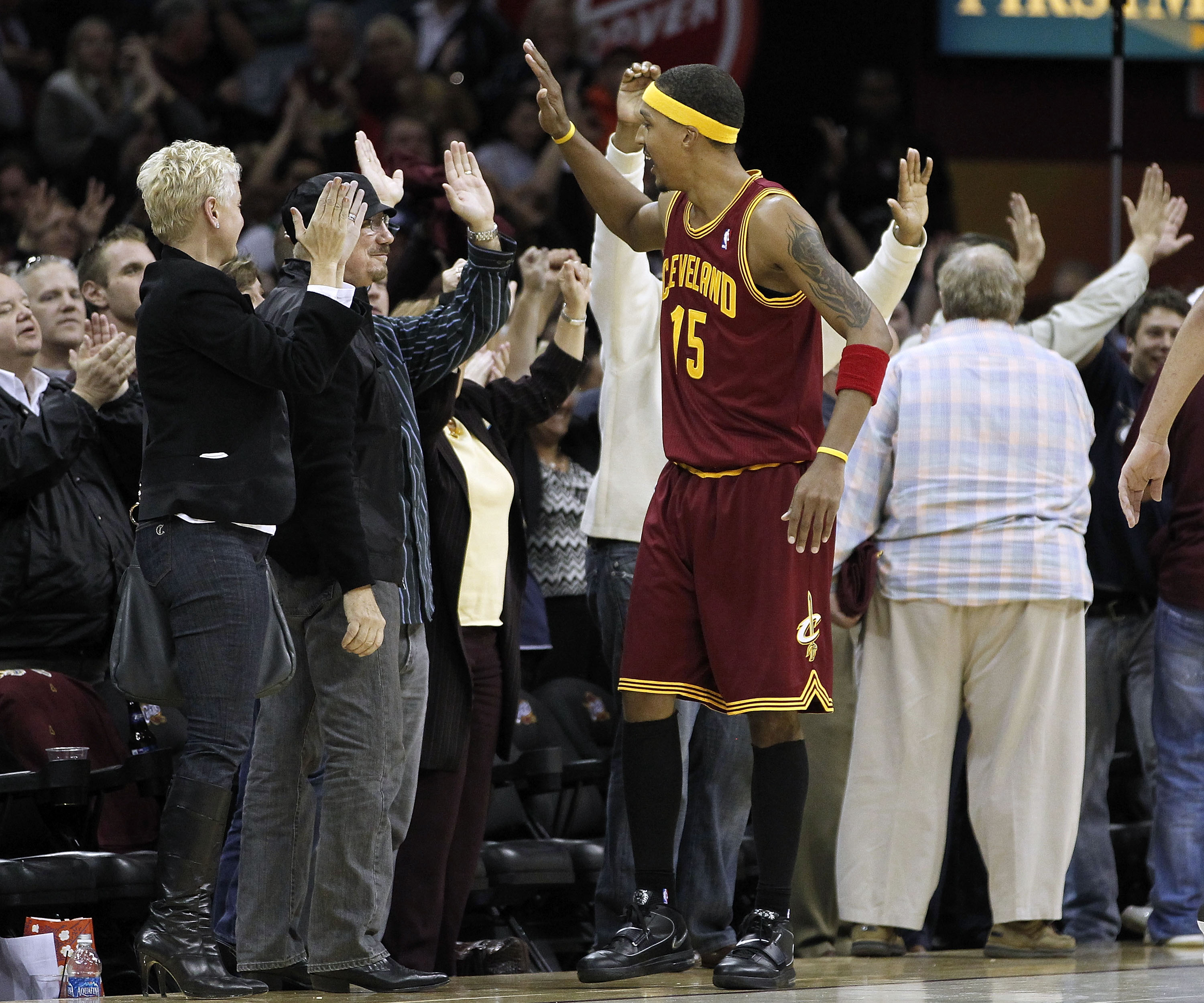 CLEVELAND - OCTOBER 27:  Jamario Moon #15 of the Cleveland Cavaliers high fives fans after beating the Boston Celtics 95-87 at Quicken Loans Arena on October 27, 2010 in Cleveland, Ohio.  (Photo by Gregory Shamus/Getty Images)