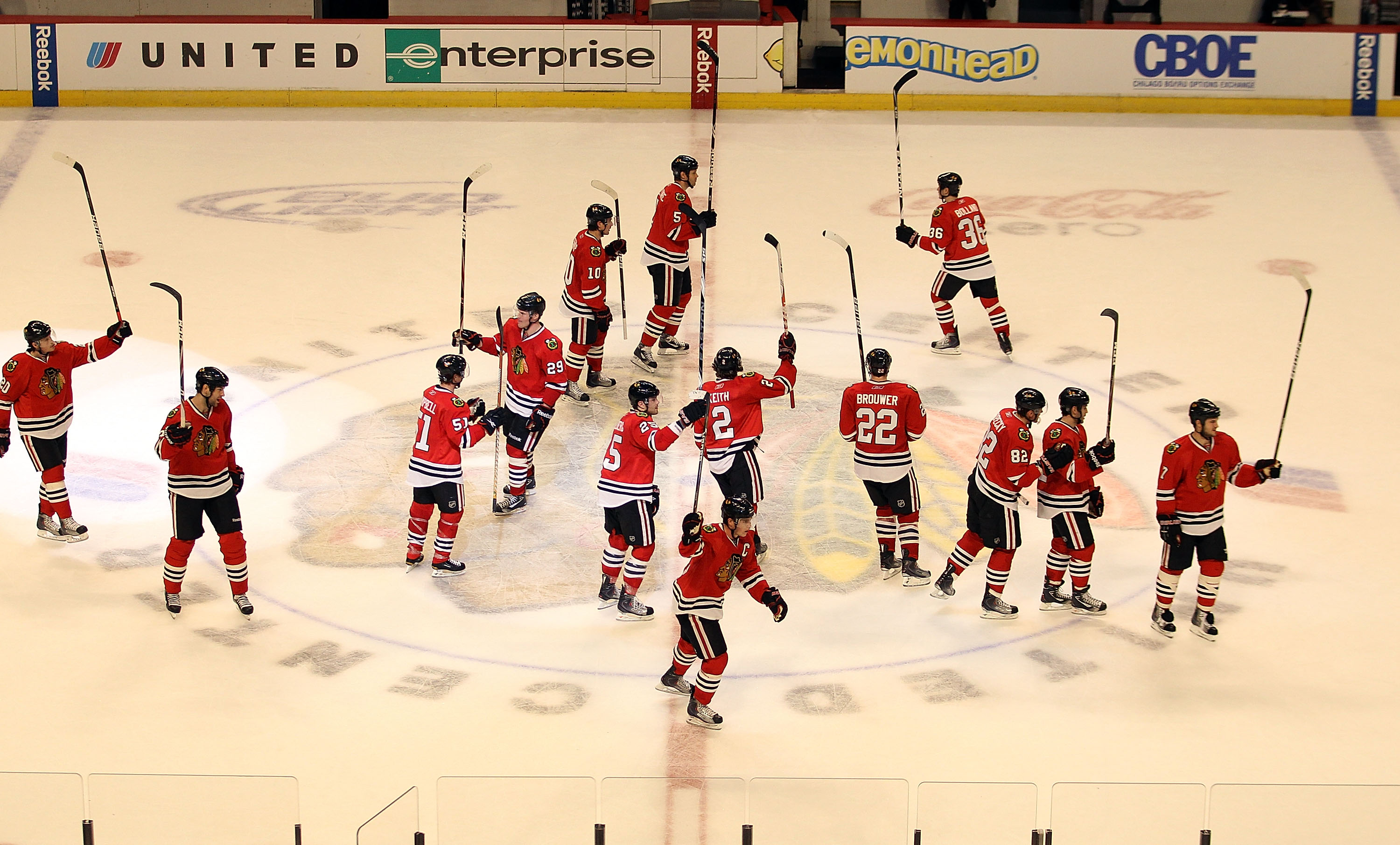 CHICAGO - NOVEMBER 30: Members of the Chicago Blackhawks salute the crowd after a win over the St. Louis Blues at the United Center on November 30, 2010 in Chicago, Illinois. The Blackhawks defeated the Blues 7-5. (Photo by Jonathan Daniel/Getty Images)