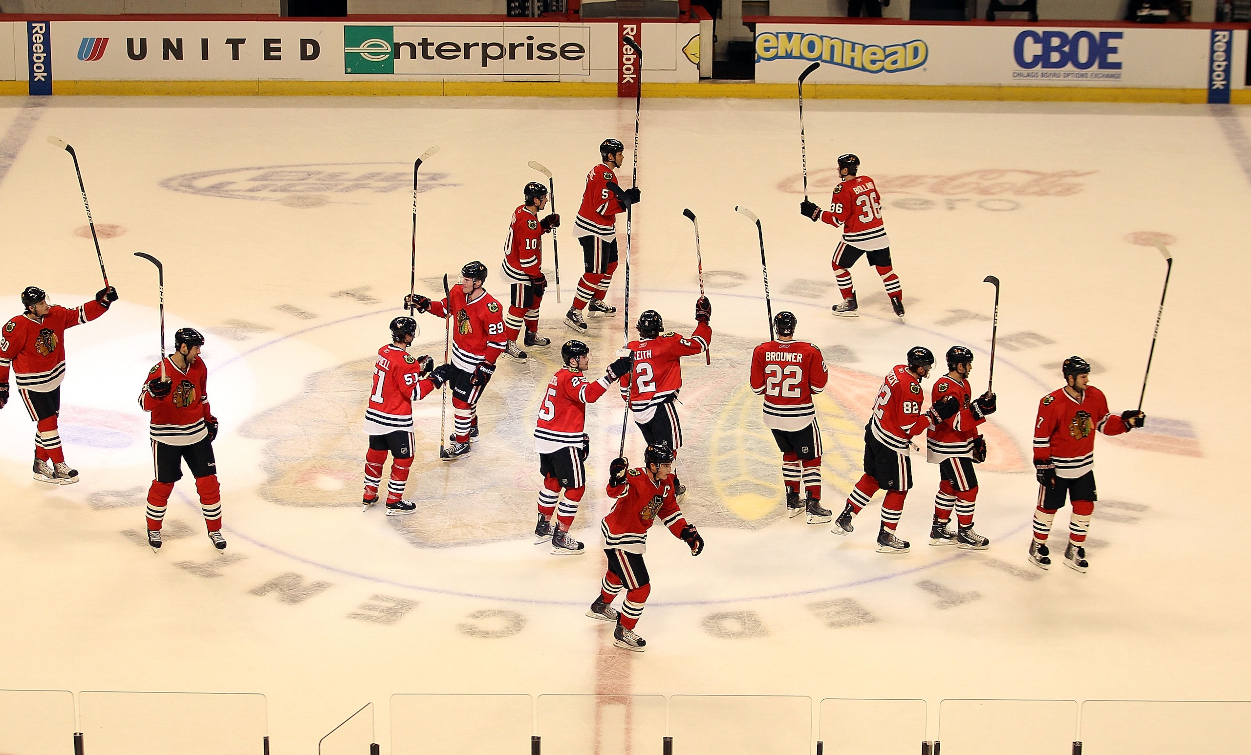CHICAGO - NOVEMBER 30: Members of the Chicago Blackhawks salute the crowd after a win over the St. Louis Blues at the United Center on November 30, 2010 in Chicago, Illinois. The Blackhawks defeated the Blues 7-5. (Photo by Jonathan Daniel/Getty Images)