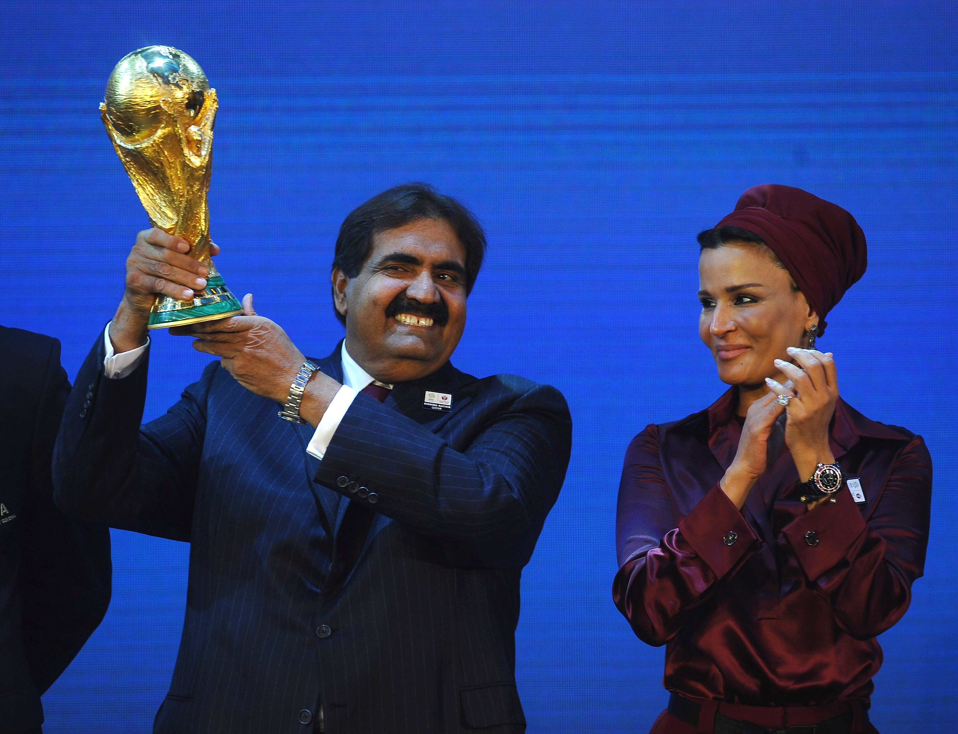 ZURICH, SWITZERLAND - DECEMBER 02:  The Emir State of Qatar HH Sheikh Hamad bin Khalifa Al-Thani and Sheikha Mozah bint Nasser Al Missned are presented with the World Cup Tophy after winning the bid for 2022 duirng the FIFA World Cup 2018 & 2022 Host Coun