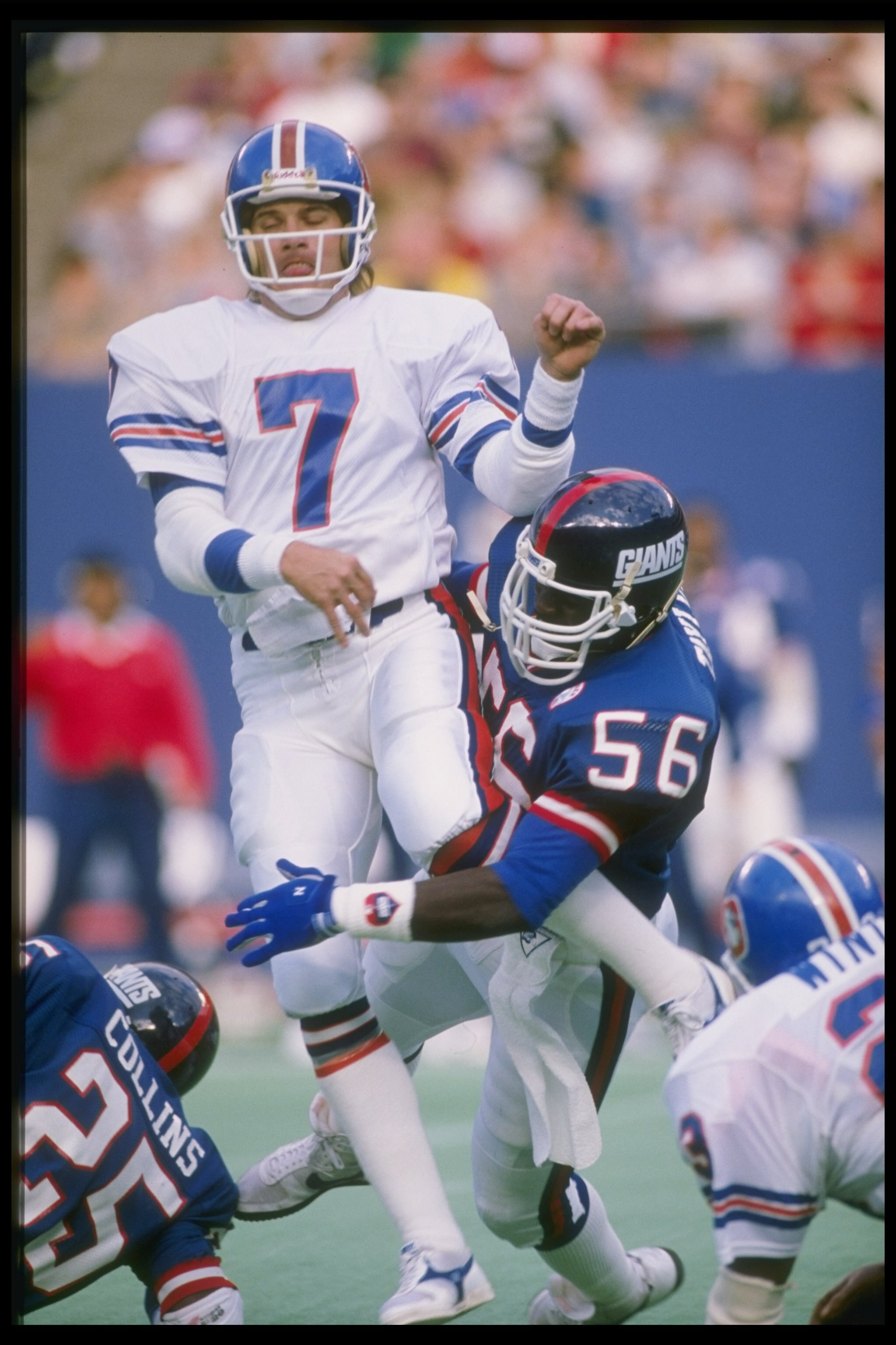 1986:  Quarterback John Elway of the Denver Broncos is sacked by linebacker Lawrence Taylor of the New York Giants during a game at Giants Stadium in East Rutherford, New Jersey.  The Giants won the game 19-16. Mandatory Credit: T. G. Higgins  /Allsport