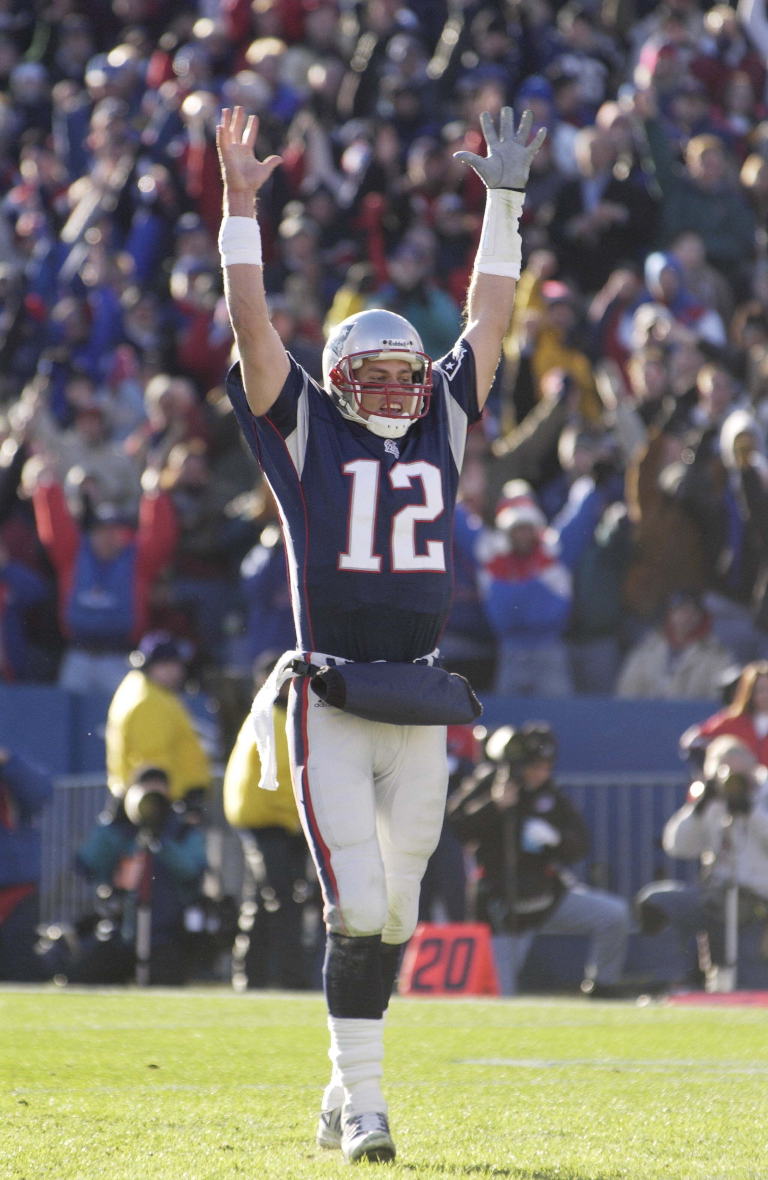 22 Dec 2001 : Tom Brady of the New England Patriots celebrates a touchdown against the Miami Dolphins during the game at Foxboro Stadium in Foxboro, Massachusetts. The Patriots defeated the Dolphins 20-13. DIGITAL IMAGE. Mandatory Credit: Ezra Shaw/Getty