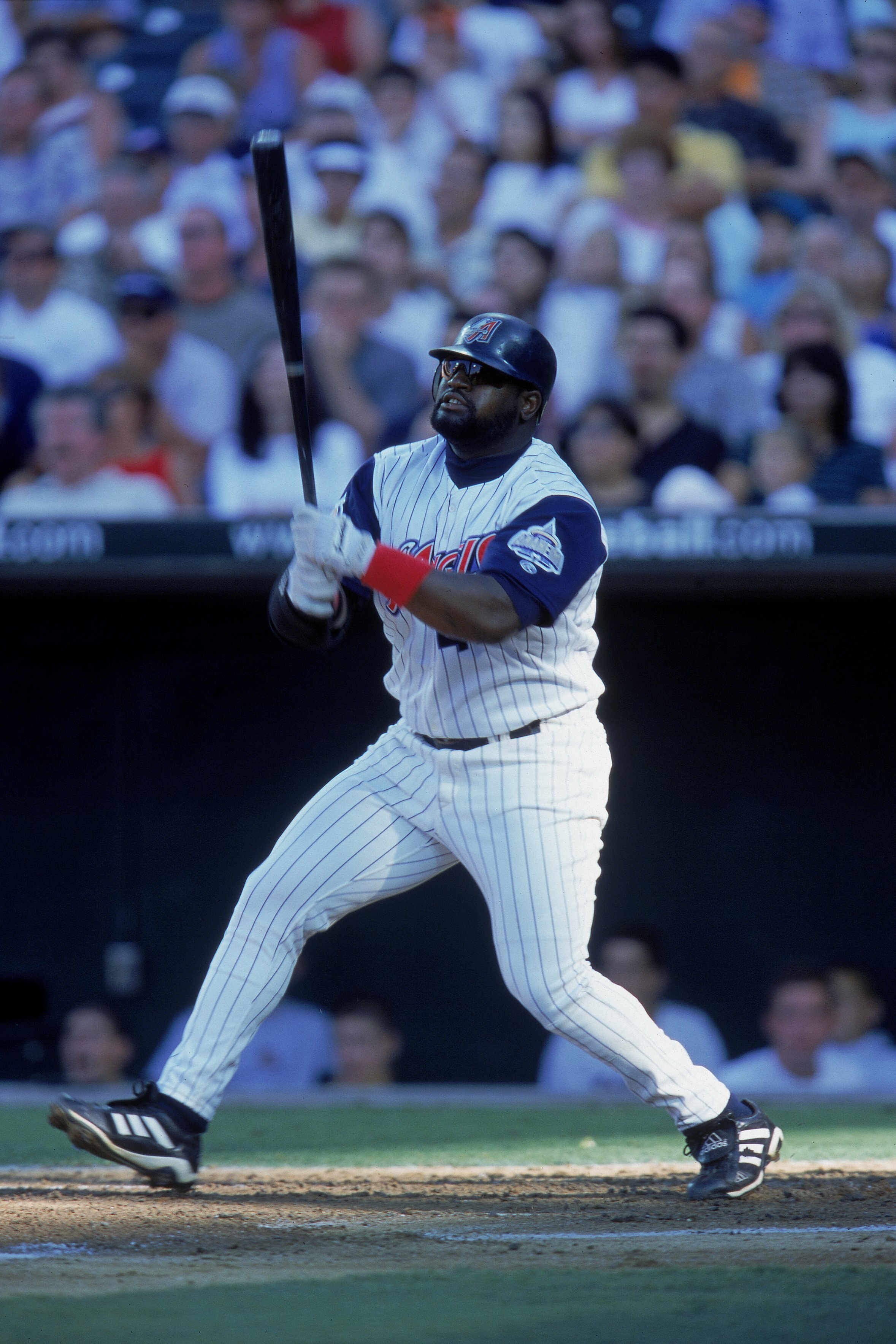 2 Jul 2000:  Mo Vaughn #42 of the Anaheim Angels watches the ball after his hit during the game against the Oakland Athletics at Edison Field in Anaheim, California. The Athletics defeated the Angels 10-3.Mandatory Credit: Stephen Dunn  /Allsport