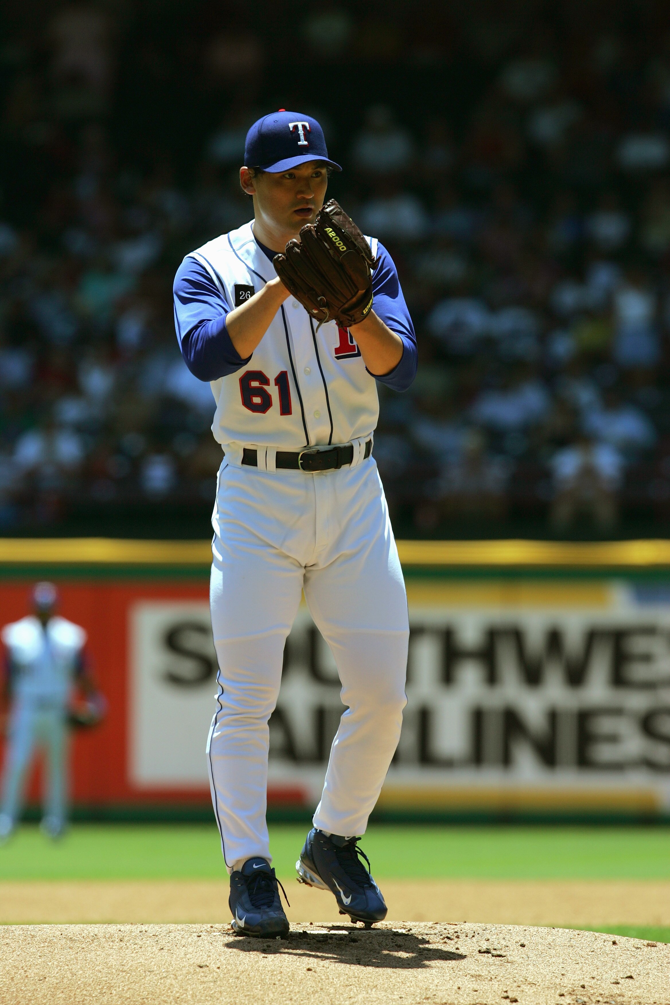 ARLINGTON, TX - JULY 24:  Chan Ho Park #21 of the Texas Rangers pitches during the game with the Oakland Atheltics on July 24, 2005 at Ameriquest Field in Arlington in Arlington, Texas.  The Athletics defeated the Rangers 8-3.  (Photo by Ronald Martinez/G