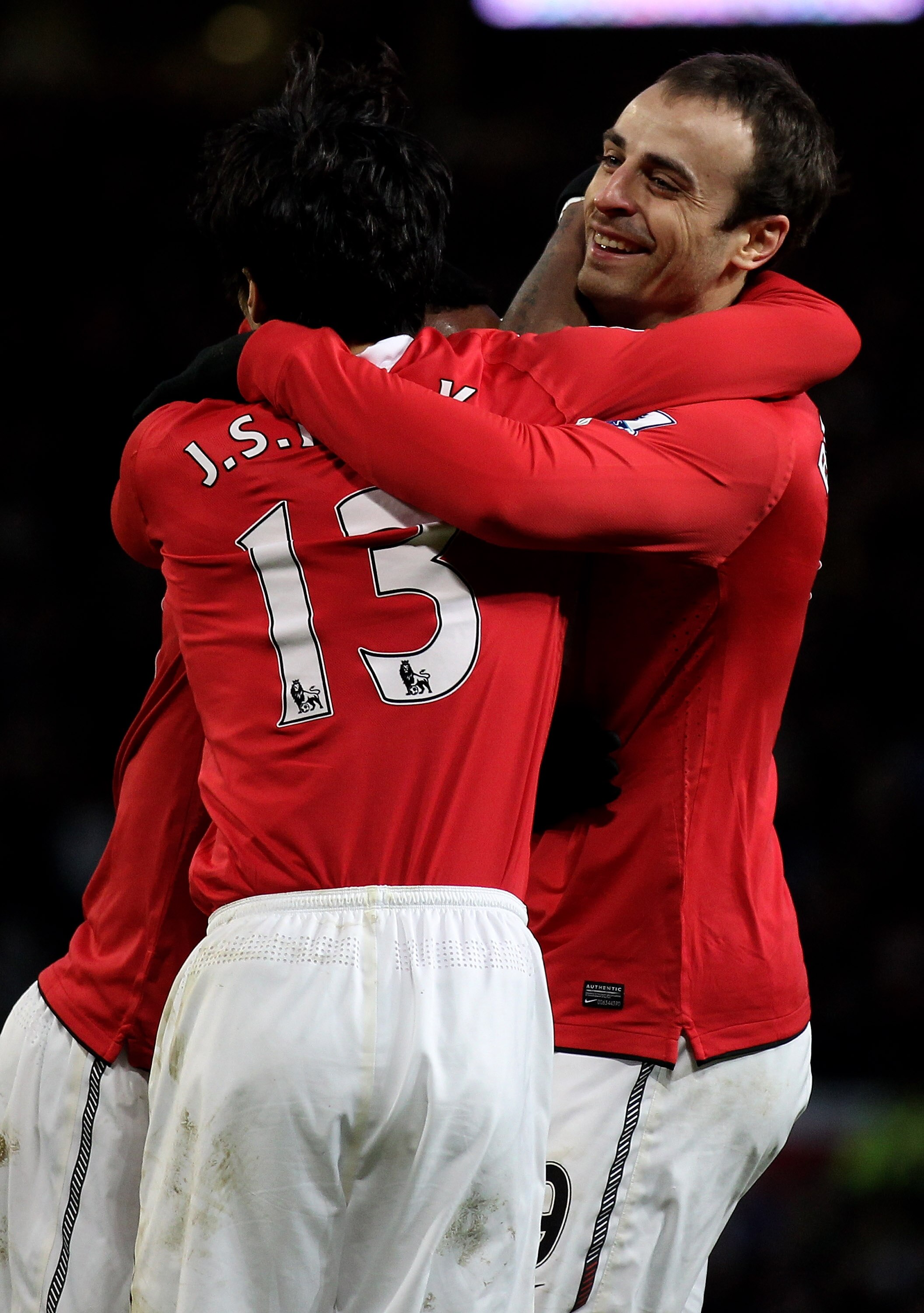 MANCHESTER, ENGLAND - NOVEMBER 27:  Dimitar Berbatov of Manchester United is congratulated by his team mates after scoring his team's fourth goal to secure his hat trick during the Barclays Premier League match between Manchester United and Blackburn Rove