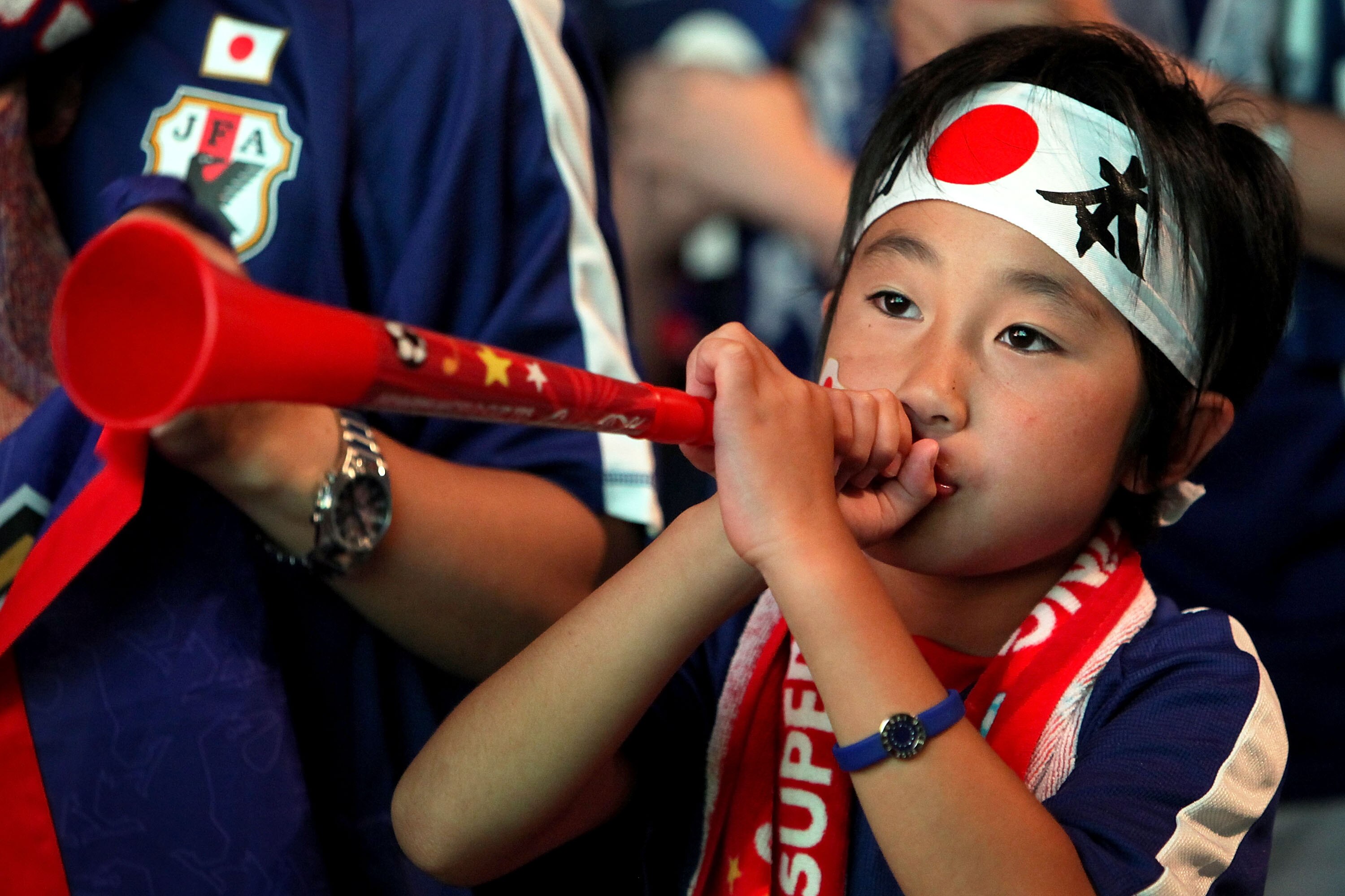 SAITAMA, JAPAN - JUNE 19:  A fan shows his support for Japan's national team as he watches a live broadcast of the 2010 FIFA World Cup South Africa Group E match between the Netherlands and Japan during a public viewing event at Saitama Super Arena on Jun