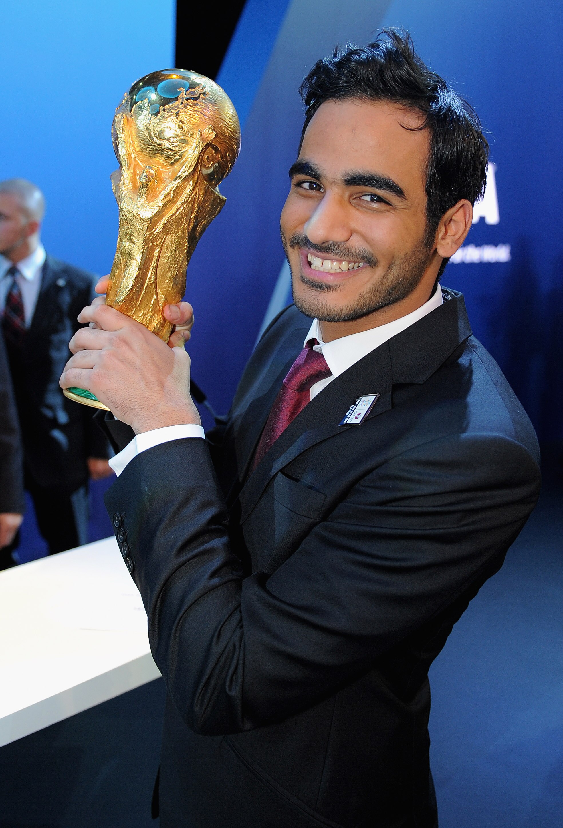 ZURICH, SWITZERLAND - DECEMBER 02: HE Sheikh Mohammes bin Hamad Al-Thani, the Chairman of the Qatar bid holds the World Cup after winning the right to host the 2022 World Cup during the FIFA World Cup 2018 & 2022 Host Announcement on December 2, 2010 in Z