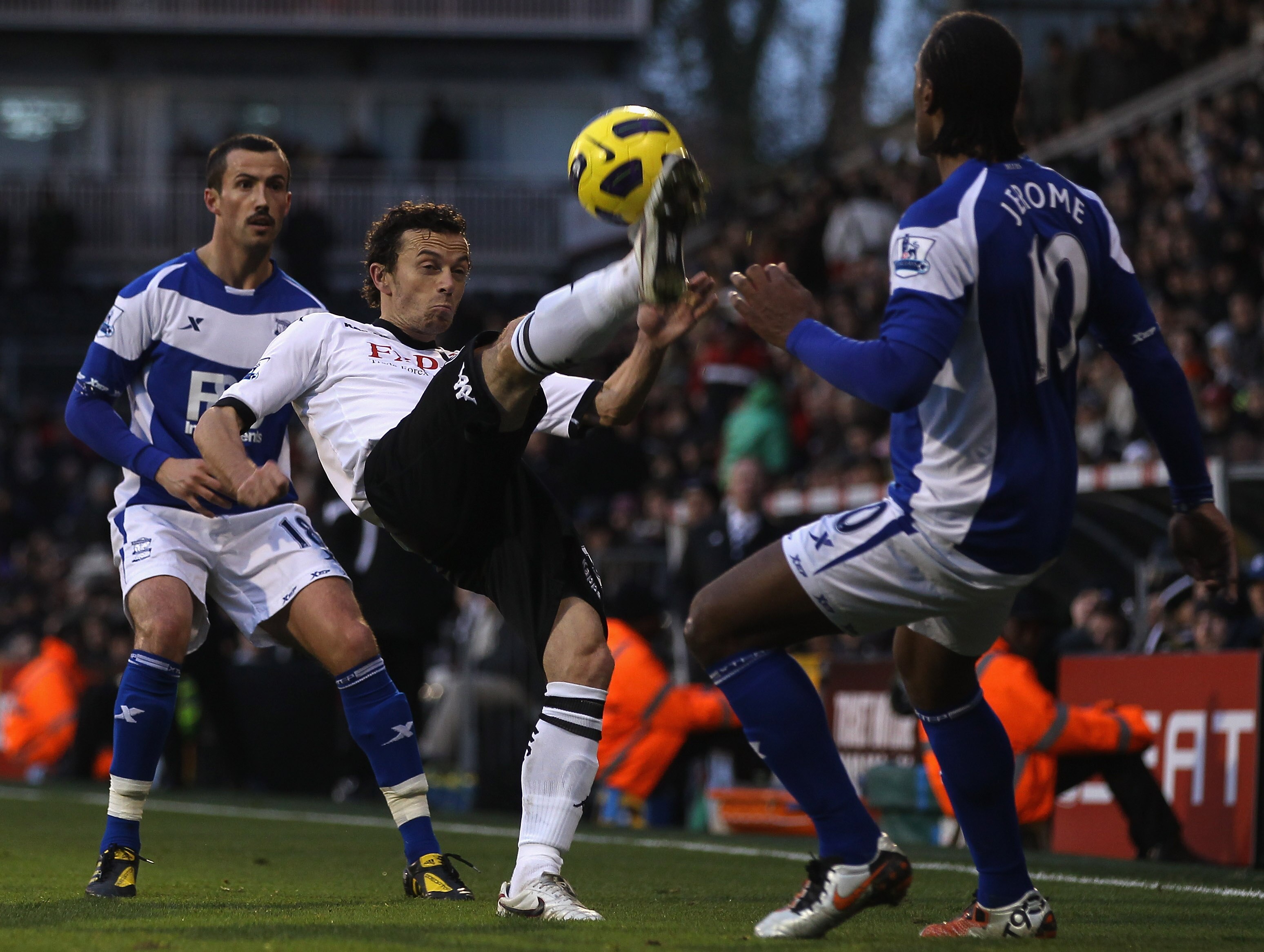 LONDON, ENGLAND - NOVEMBER 27:  Keith Fahey of Birmingham City tries to tackle Simon Davies of Fulham during the Barclays Premier League match between Fulham and Birmingham City at Craven Cottage on November 27, 2010 in London, England.  (Photo by Ian Wal
