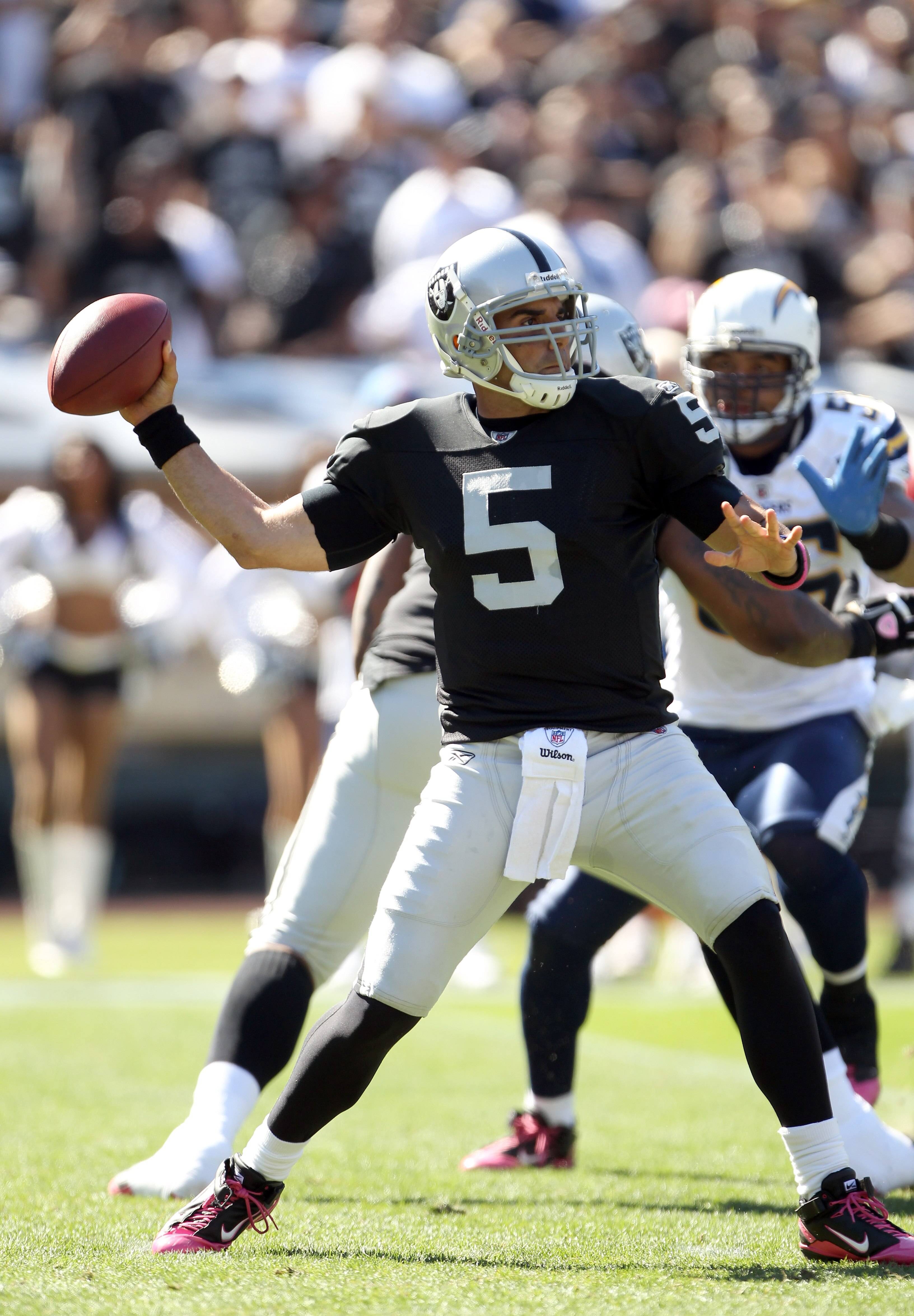 OAKLAND, CA - OCTOBER 10:  Bruce Gradkowski #5 of the Oakland Raiders passes the ball against the San Diego Chargers at Oakland-Alameda County Coliseum on October 10, 2010 in Oakland, California.  (Photo by Ezra Shaw/Getty Images)