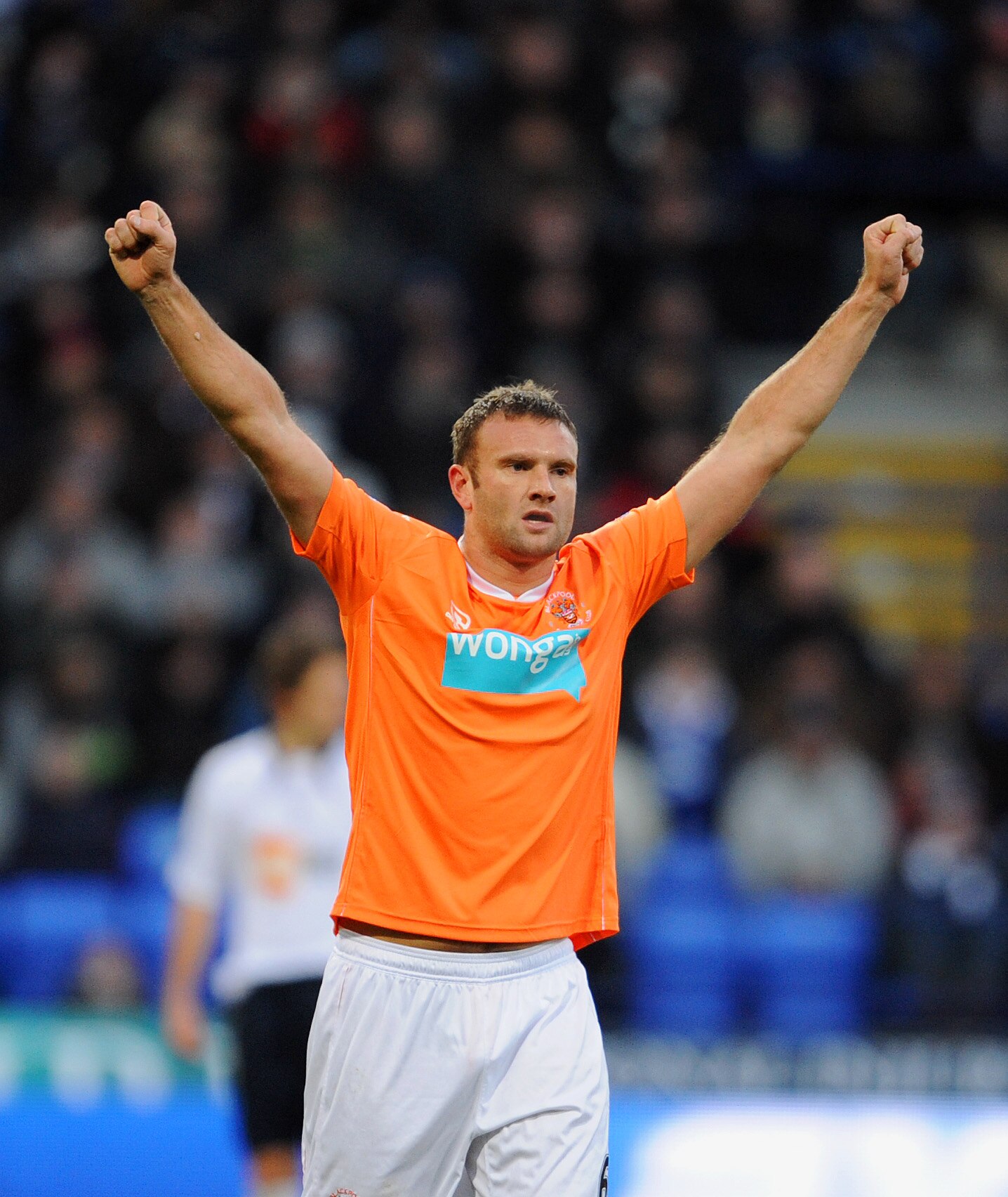 BOLTON, UNITED KINGDOM - NOVEMBER 27: Ian Evatt of Blackpool celebrates after scoring his sides first goal during the Barclays Premier League match between Bolton Wanderers and Blackpool at the Reebok Stadium on November 27, 2010 in Bolton, England. (Phot