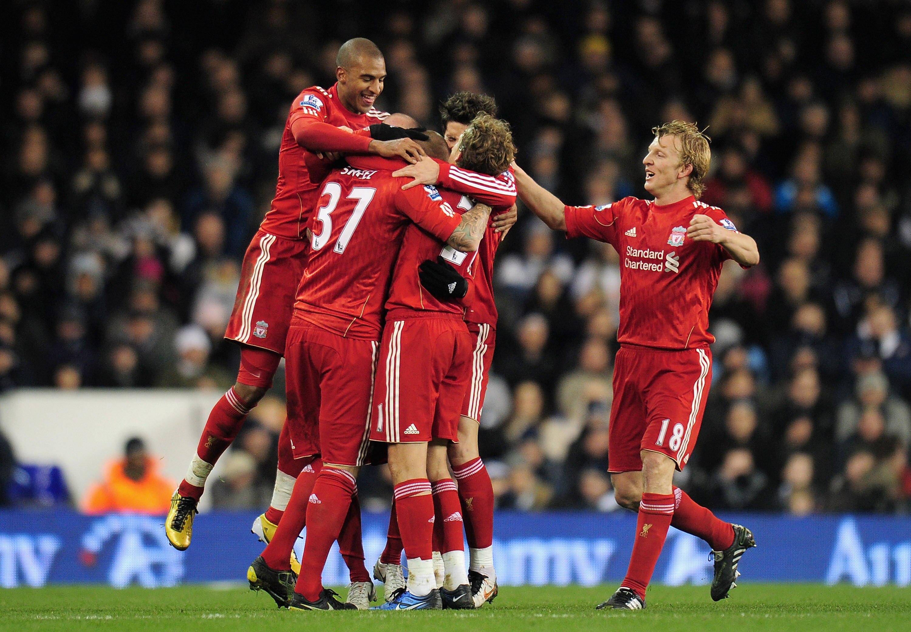 LONDON, ENGLAND - NOVEMBER 28:  Dirk Kuyt of Liverpool (R) joins his team mates as they celebrate the opening goal by Martin Skrtel during the Barclays Premier League match between Tottenham Hotspur and Liverpool at White Hart Lane on November 28, 2010 in