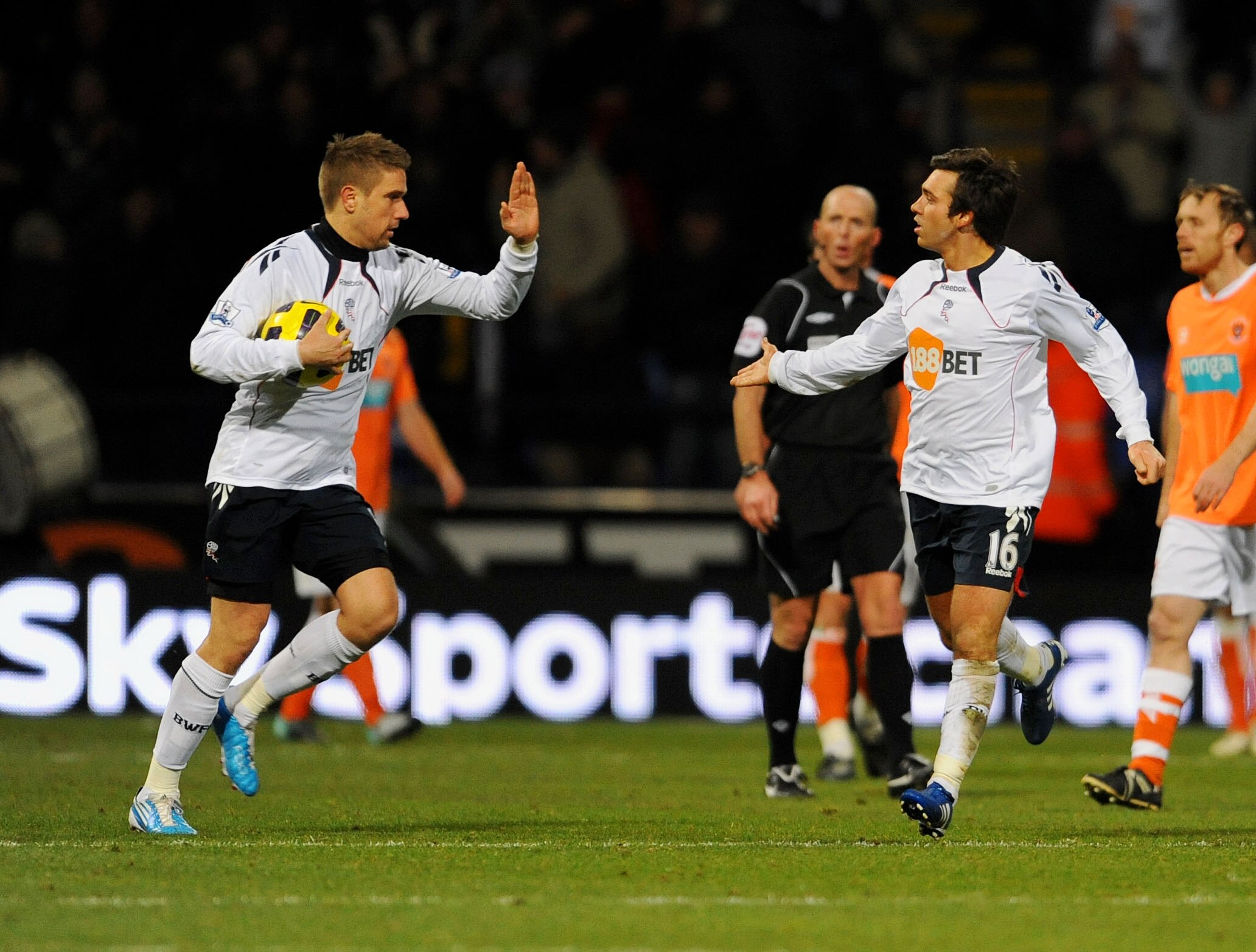BOLTON, UNITED KINGDOM - NOVEMBER 27: Mark Davies (R) of Bolton  celebrates after scoring the second goal for his side during the Barclays Premier League match between Bolton Wanderers and Blackpool at the Reebok Stadium on November 27, 2010 in Bolton, En
