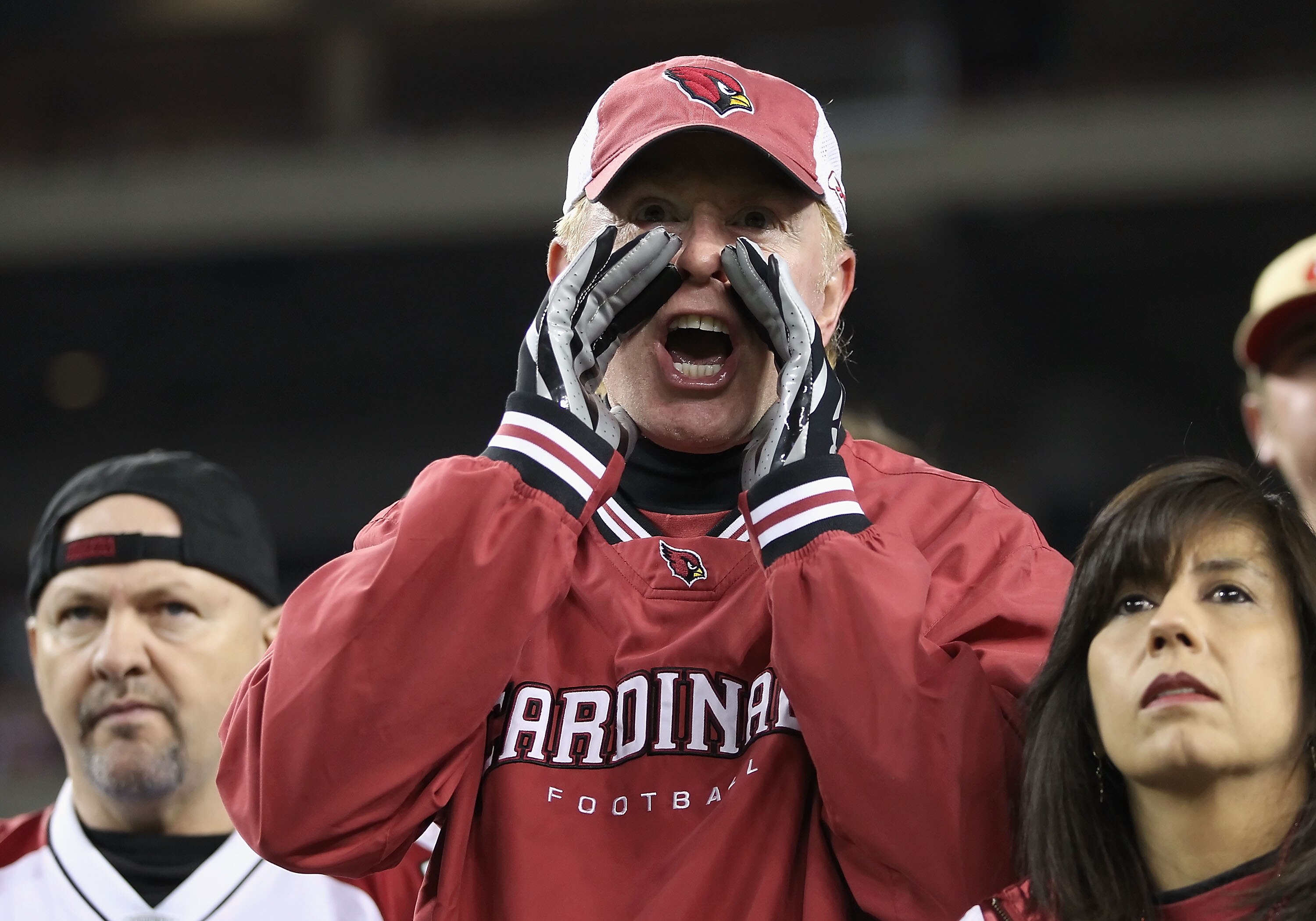 GLENDALE, AZ - NOVEMBER 29:  Fans of the Arizona Cardinals yell at their team during the NFL game against the San Francisco 49ers at the University of Phoenix Stadium on November 29, 2010 in Glendale, Arizona.  The 49ers defeated the Cardinals 27-6. (Phot