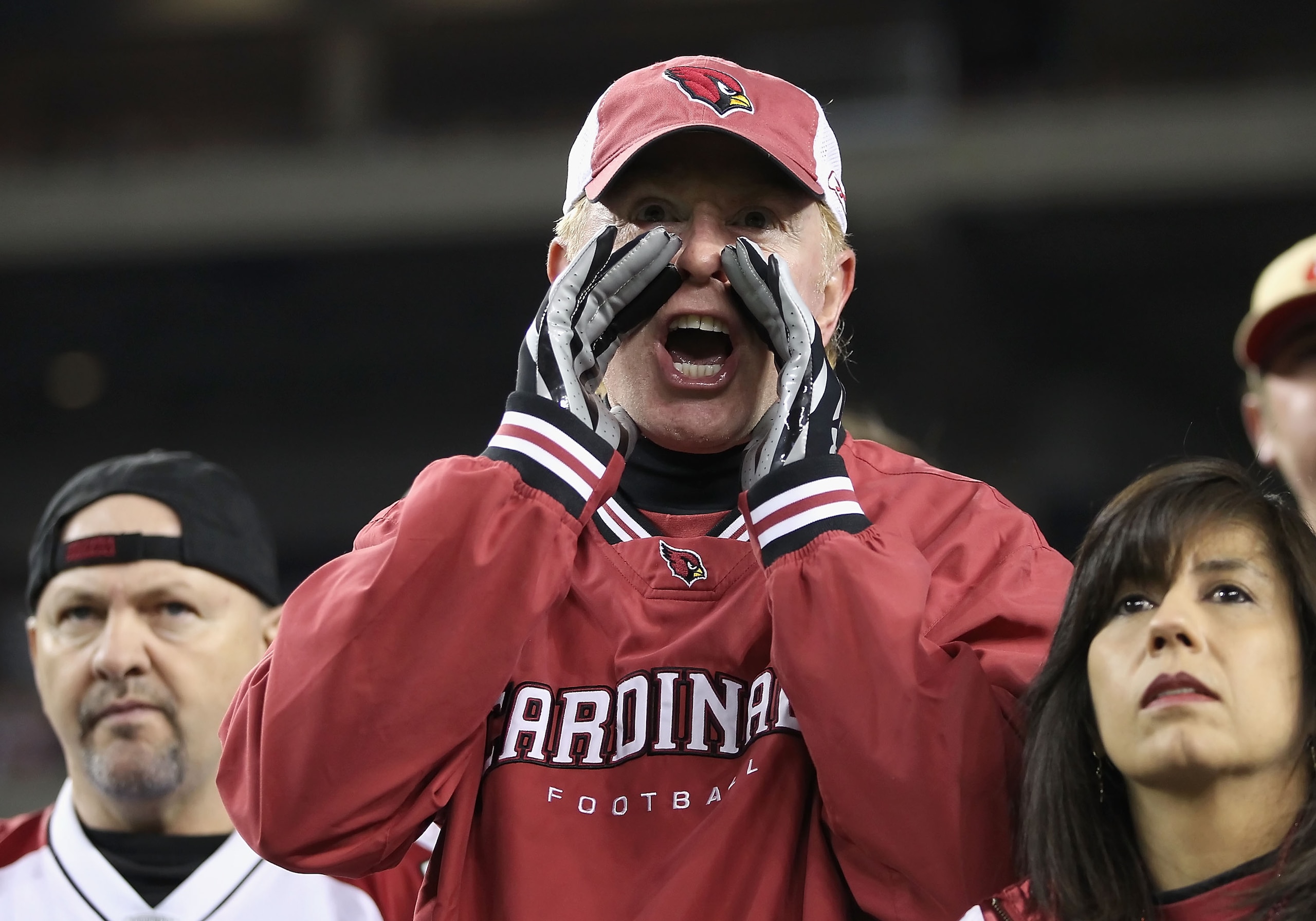 GLENDALE, AZ - NOVEMBER 29:  Fans of the Arizona Cardinals yell at their team during the NFL game against the San Francisco 49ers at the University of Phoenix Stadium on November 29, 2010 in Glendale, Arizona.  The 49ers defeated the Cardinals 27-6. (Phot
