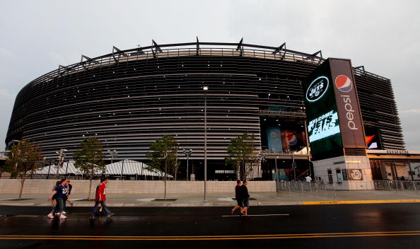 EAST RUTHERFORD, NJ - AUGUST 16:  Fans walk into the New Meadowlands Stadium for a preseason game between the New York Jets and New York Giants on August 16, 2010 in East Rutherford, New Jersey.  (Photo by Andrew Burton/Getty Images)