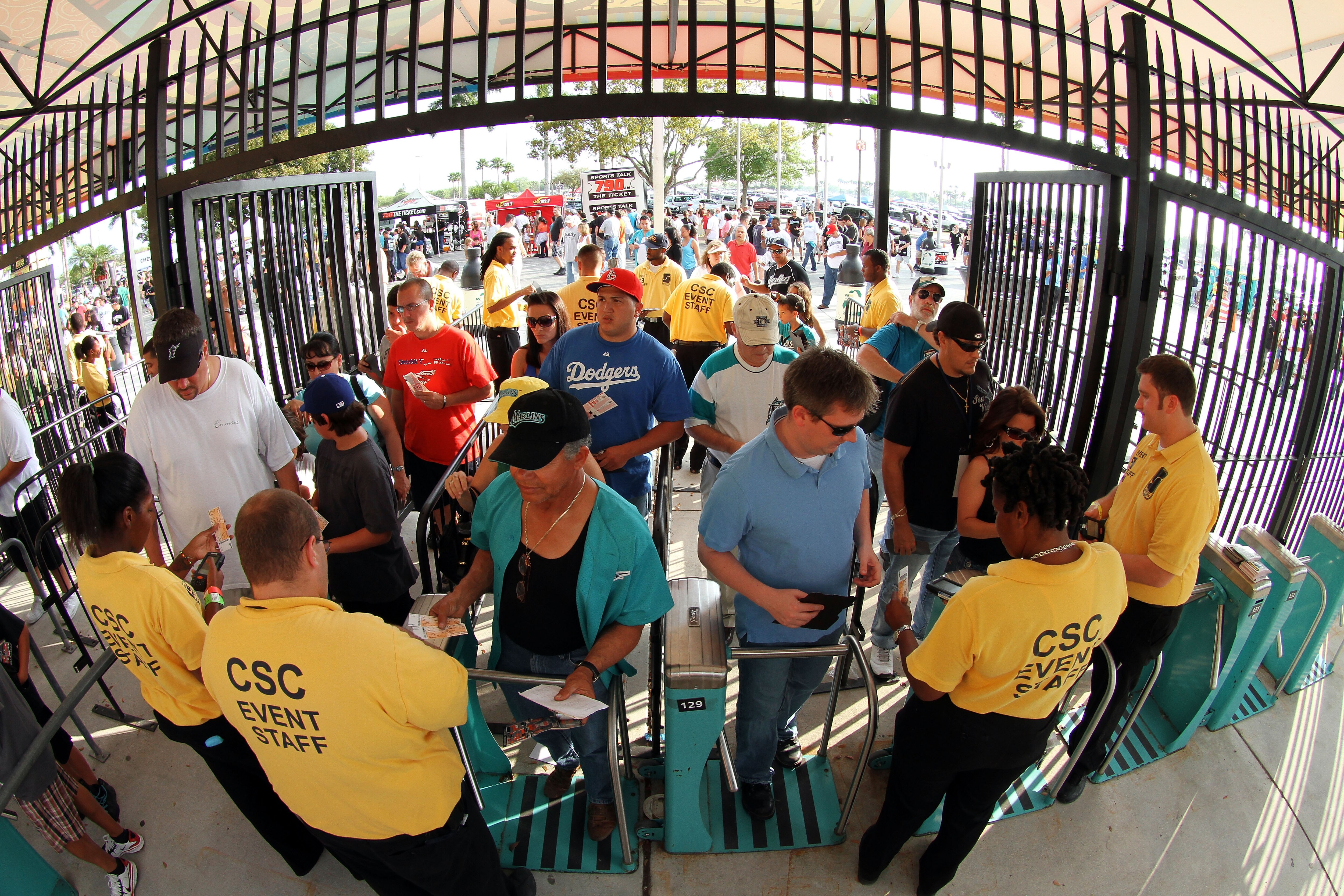 MIAMI - APRIL 09:  Fans file through turnstyles before the Los Angeles Dodgers take on the Florida Marlins during the Marlins home opening game at Sun Life Stadium on April 9, 2010 in Miami, Florida.  (Photo by Doug Benc/Getty Images)