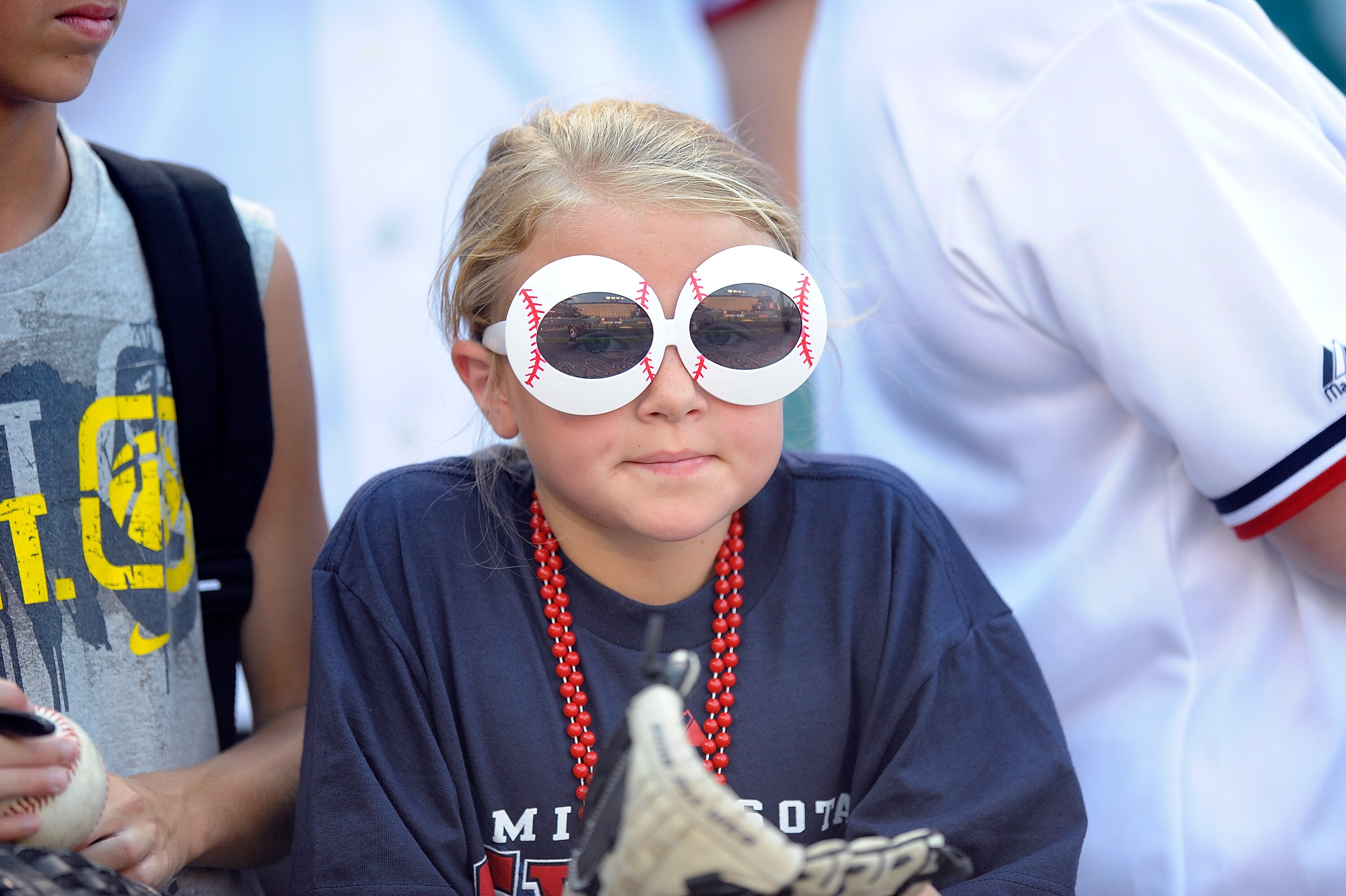 BALTIMORE - JULY 22:  A young fan watches batting practice before the game between the Minnesota Twins and the Baltimore Orioles at Camden Yards on July 22, 2010 in Baltimore, Maryland.  (Photo by Greg Fiume/Getty Images)