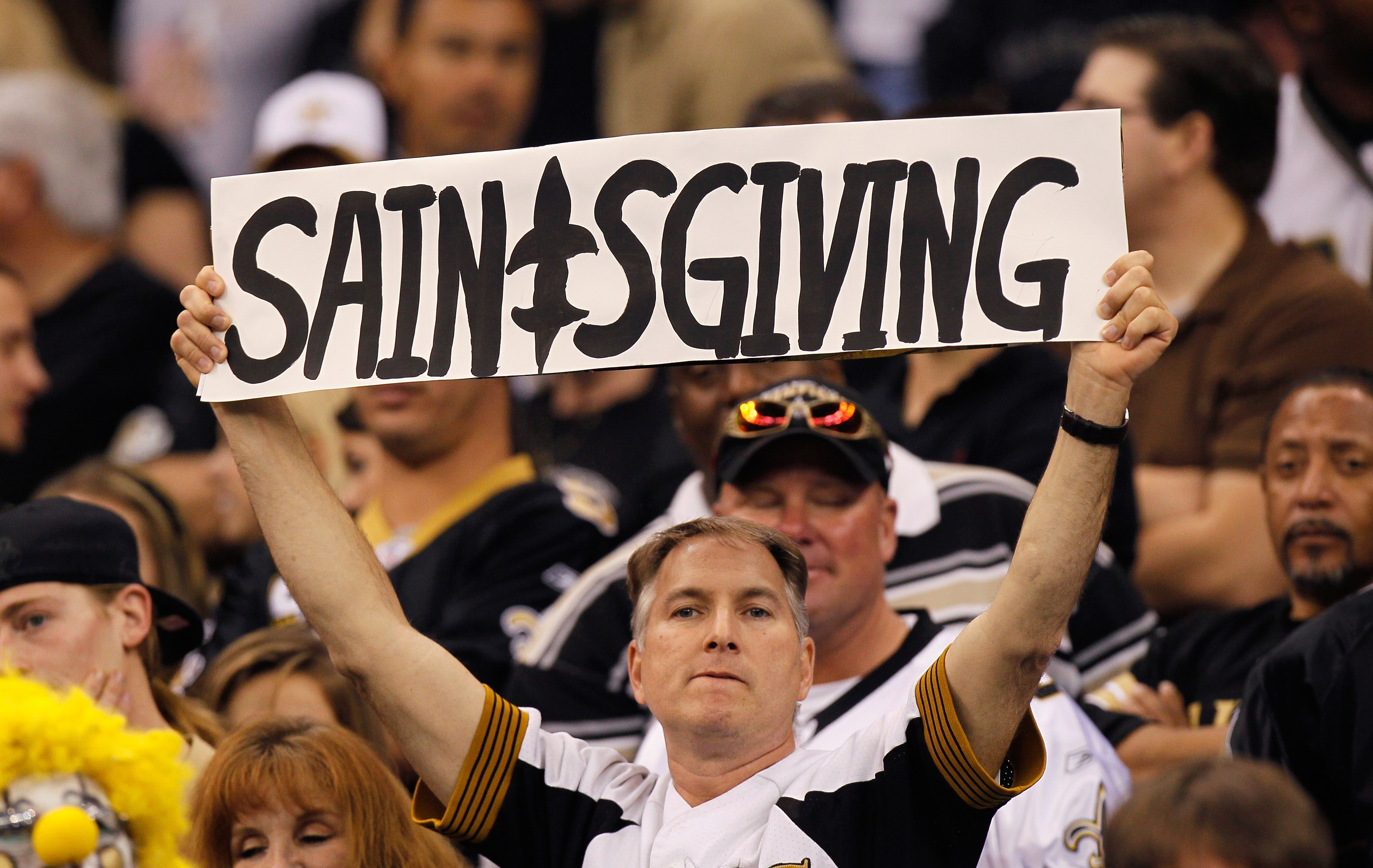 NEW ORLEANS - NOVEMBER 21:  A fan of the New Orleans Saints holds up a sign for 'Saintsgiving' during the sign against the Seattle Seahawks at Louisiana Superdome on November 21, 2010 in New Orleans, Louisiana.  (Photo by Kevin C. Cox/Getty Images)