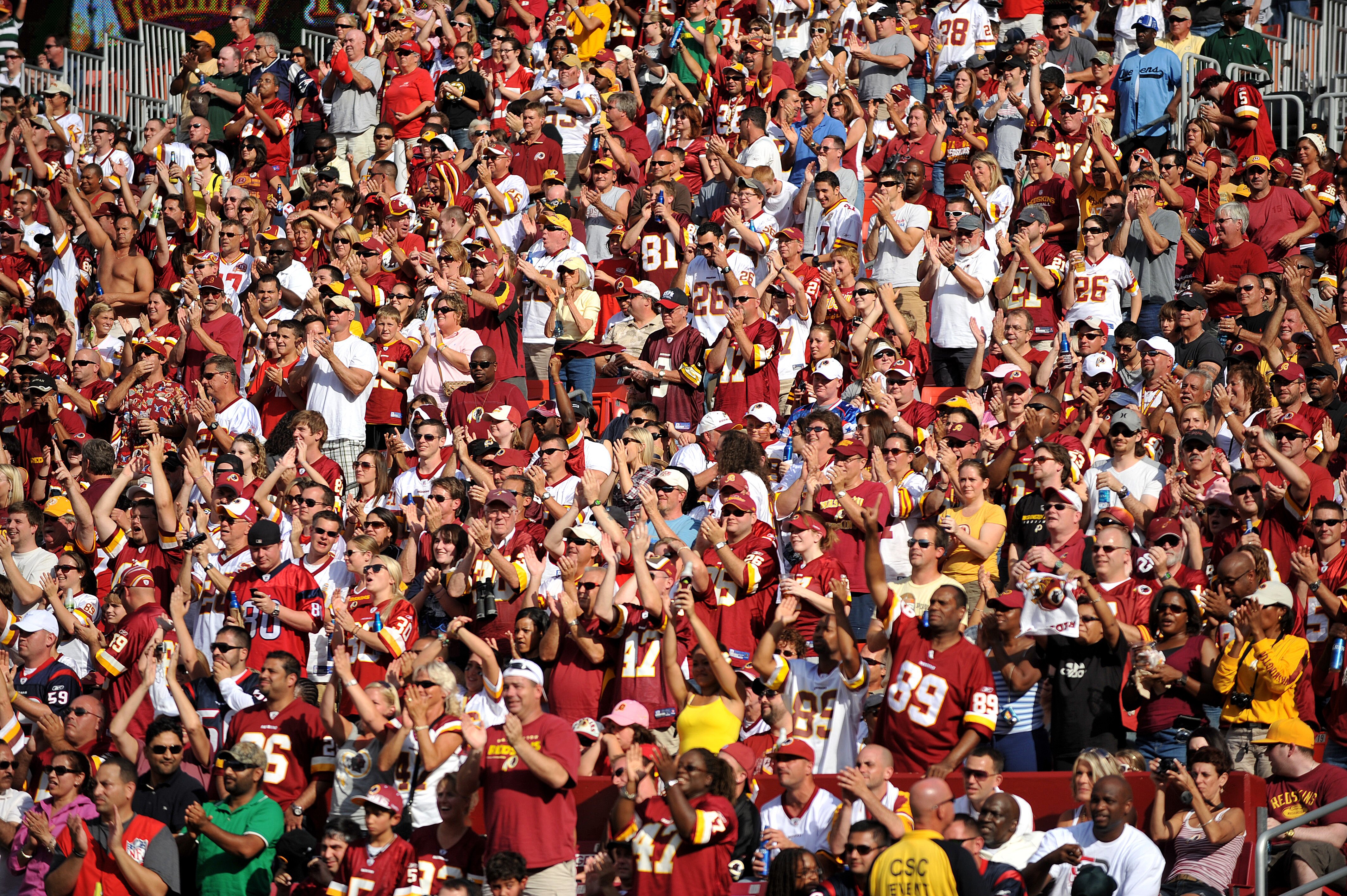 LANDOVER - SEPTEMBER 19:  Fans of the Washington Redskins cheer against the Houston Texans at FedExField on September 19, 2010 in Landover, Maryland. The Texans defeated the Redskins in overtime 30-27. (Photo by Larry French/Getty Images)