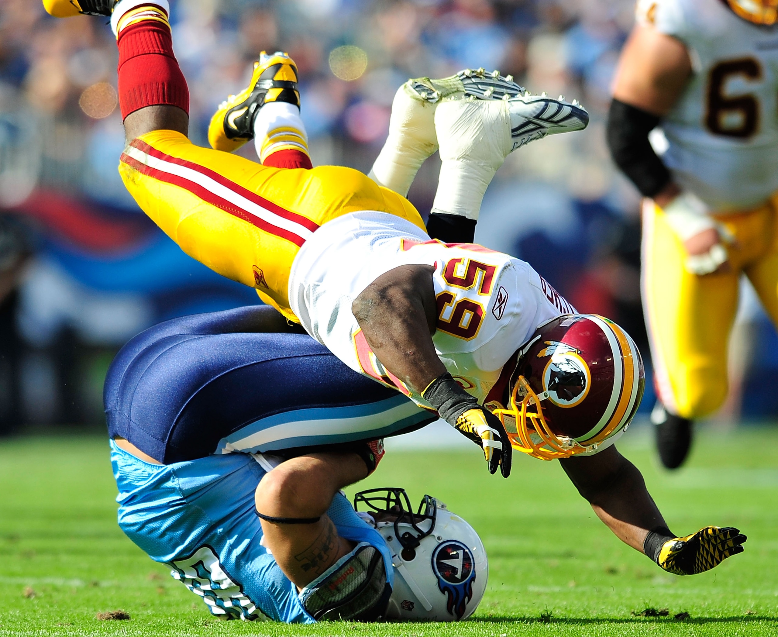 NASHVILLE, TN - NOVEMBER 21:  London Fletcher #59 of the Washington Redskins tackles Chris Johnson #28 of the Tennessee Titans during the first half at LP Field on November 21, 2010 in Nashville, Tennessee.  (Photo by Grant Halverson/Getty Images)