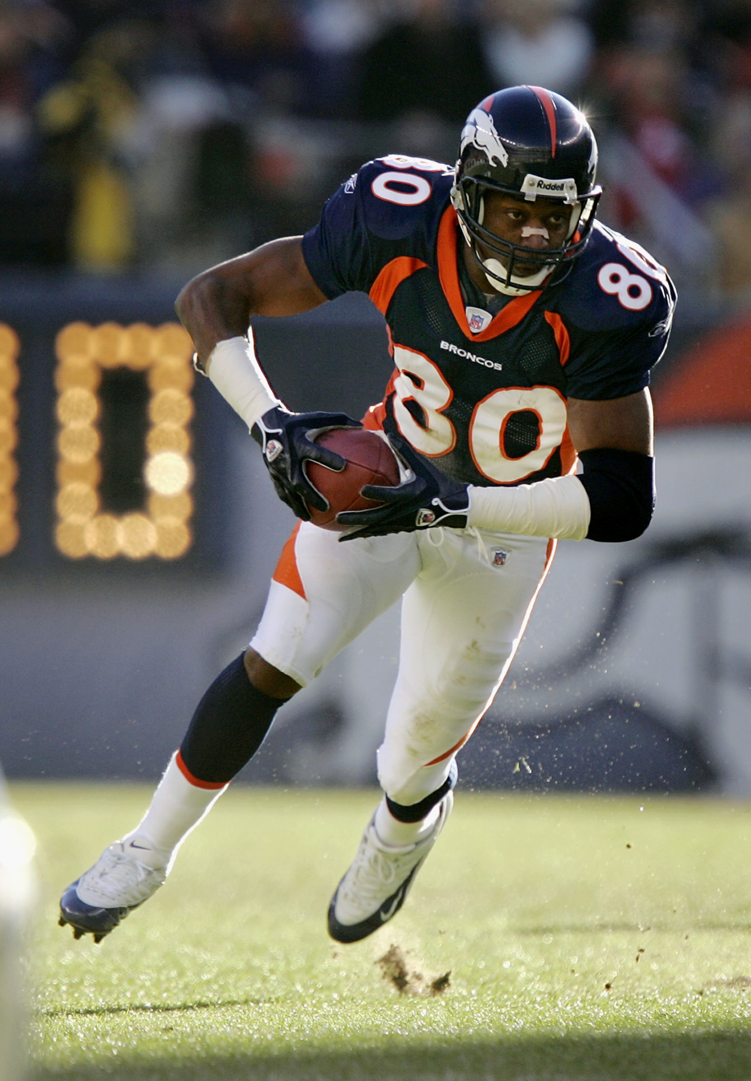 DENVER - DECEMBER 11:  Wide receiver Rod Smith #80 of the Denver Broncos carries the ball against the Baltimore Ravens during the game on December 11, 2005 at Invesco Field at Mile High in Denver, Colorado.  The Broncos won 12-10.  (Photo by Brian Bahr/Ge