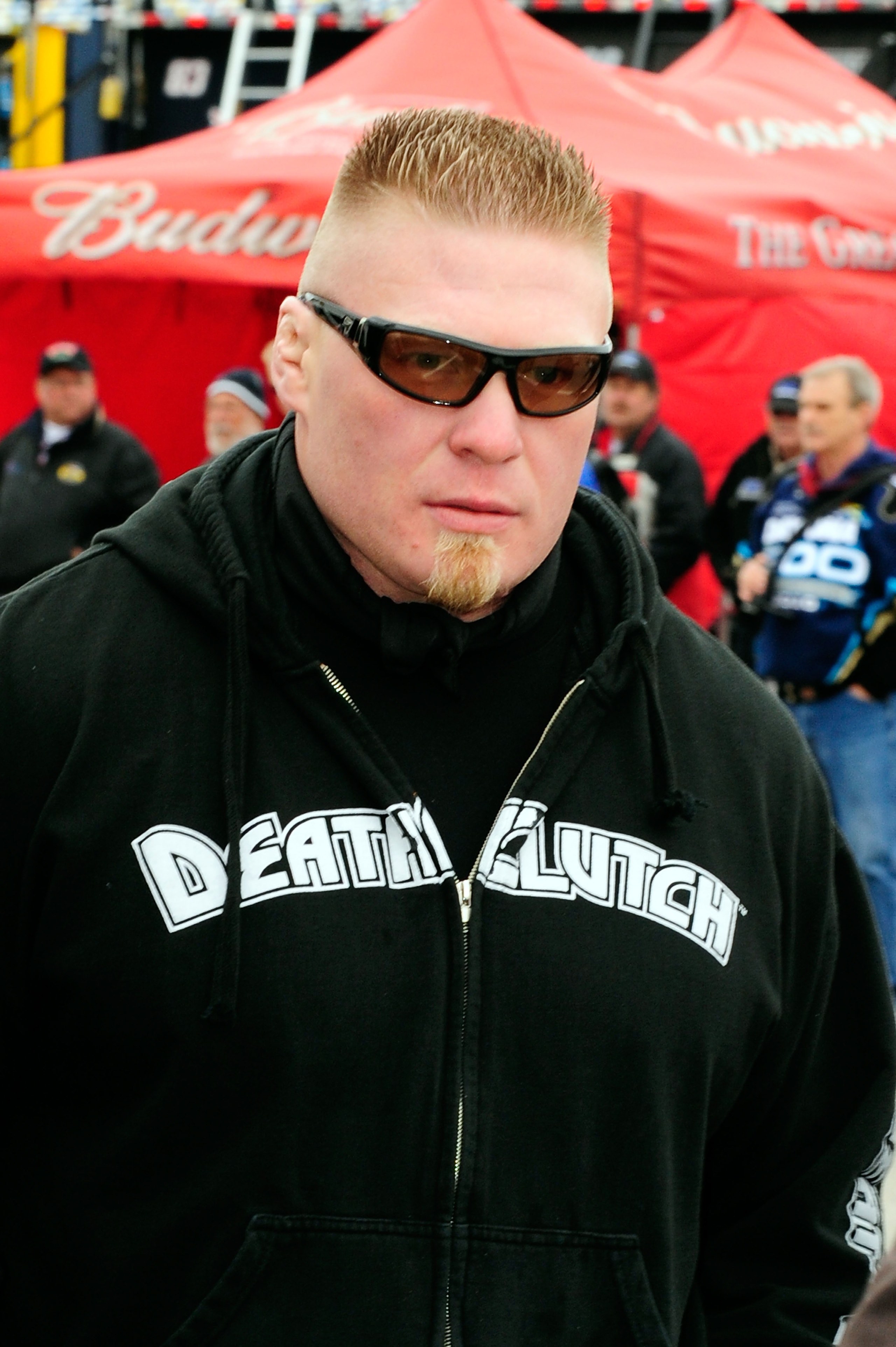 DAYTONA BEACH, FL - FEBRUARY 13: MMA fighter Brock Lesnar walks in the garage area during practice for the Daytona 500 at Daytona International Speedway on February 13, 2010 in Daytona Beach, Florida. (Photo by Sam Greenwood/Getty Images for NASCAR) DAYTONA BEACH, FL - FEBRUARY 13: MMA fighter Brock Lesnar walks in the garage area during practice for the Daytona 500 at Daytona International Speedway on February 13, 2010 in Daytona Beach, Florida. (Photo by Sam Greenwood/Getty Images for NASCAR)