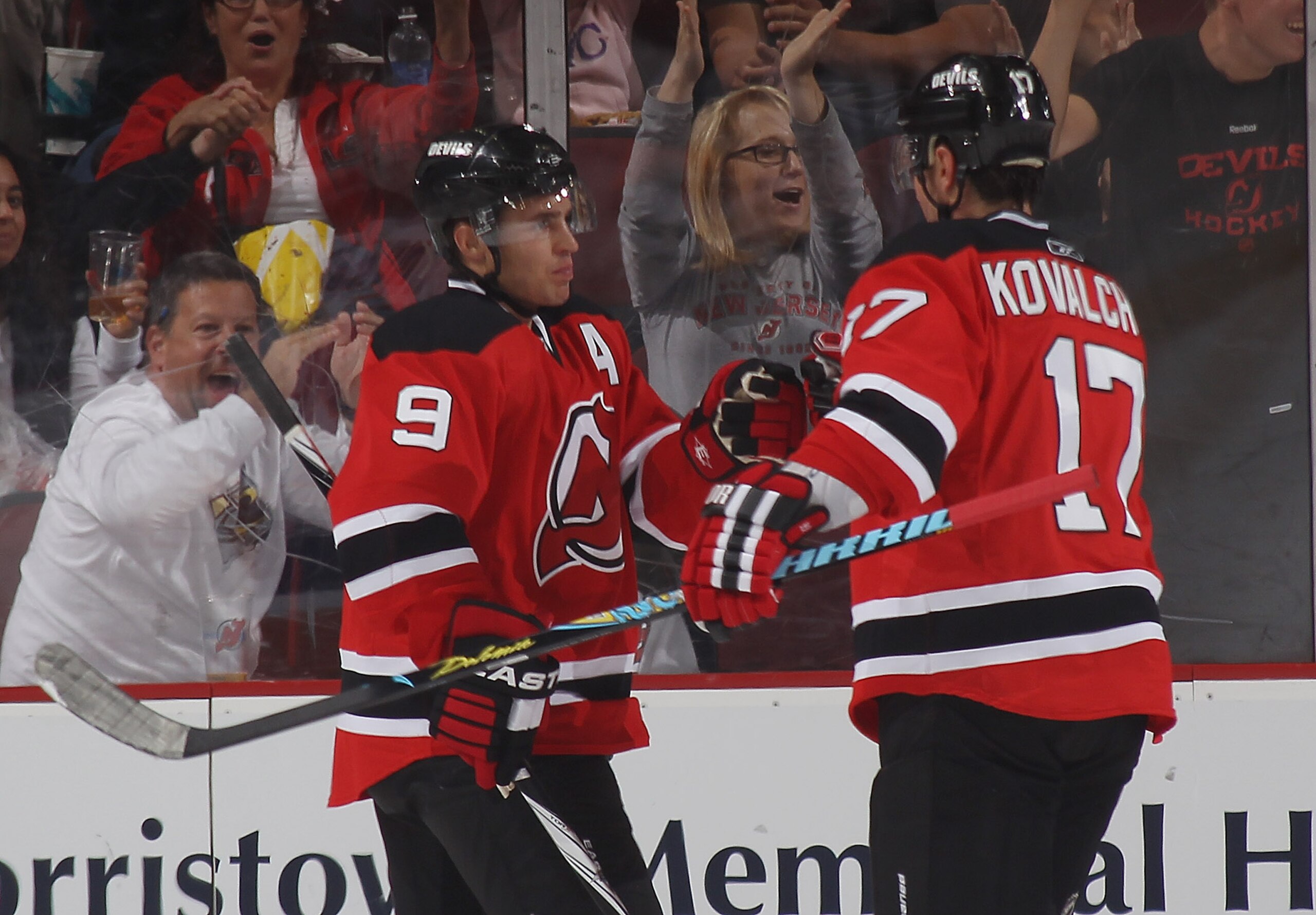 NEWARK, NJ - OCTOBER 01: Zach Parise #9 and Ilya Kovalchuk #17 of the New Jersey Devils celebrate Parise's goal at 14:14 of the first period against the New York Islanders at the Prudential Center on October 1, 2010 in Newark, New Jersey.  (Photo by Bruce