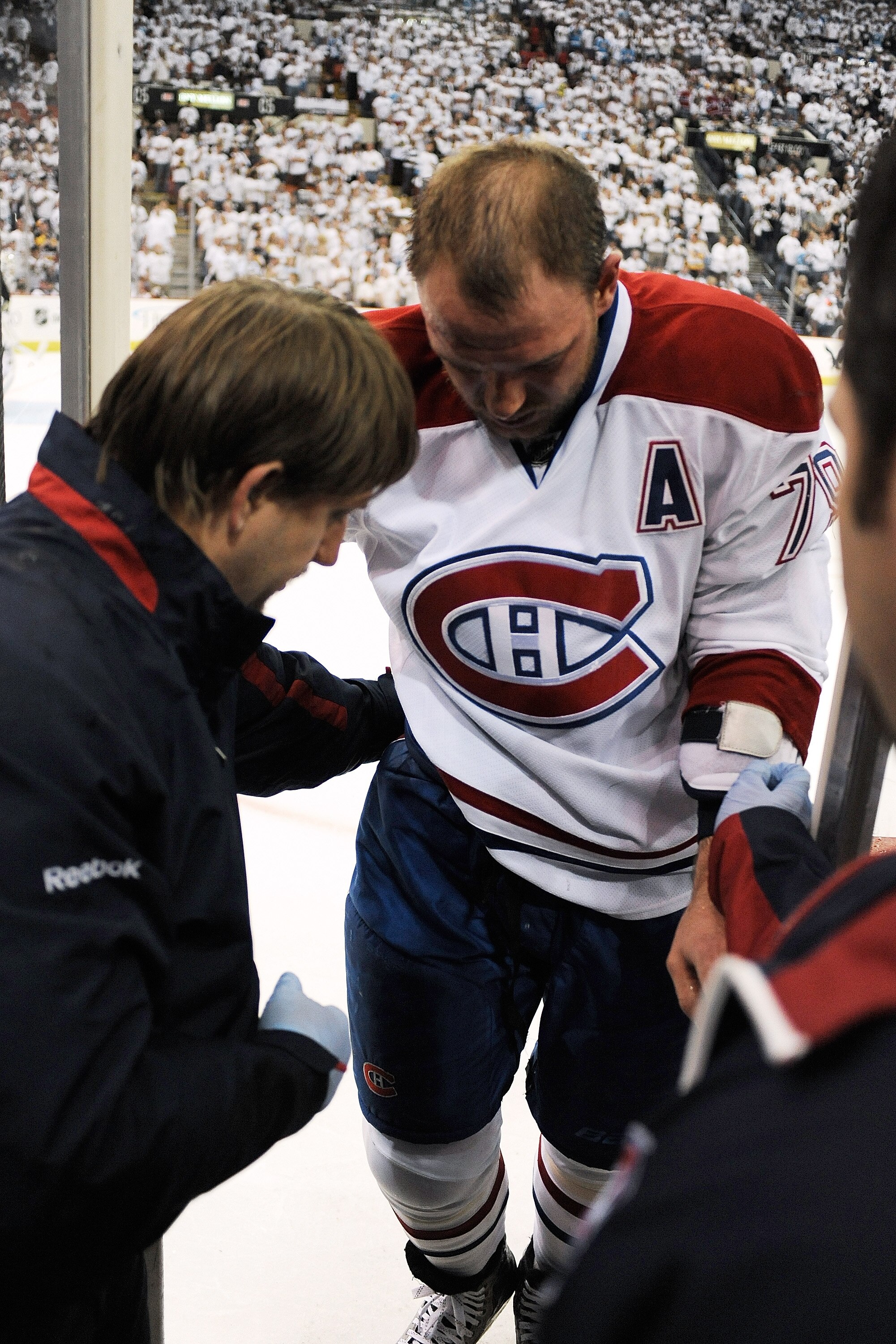 PITTSBURGH - APRIL 30:  Andrei Markov #79 of the Montreal Canadiens is assisted off the ice to the dressing room after being injured in the first period against the Pittsburgh Penguins in Game One of the Eastern Conference Semifinals during the 2010 NHL S
