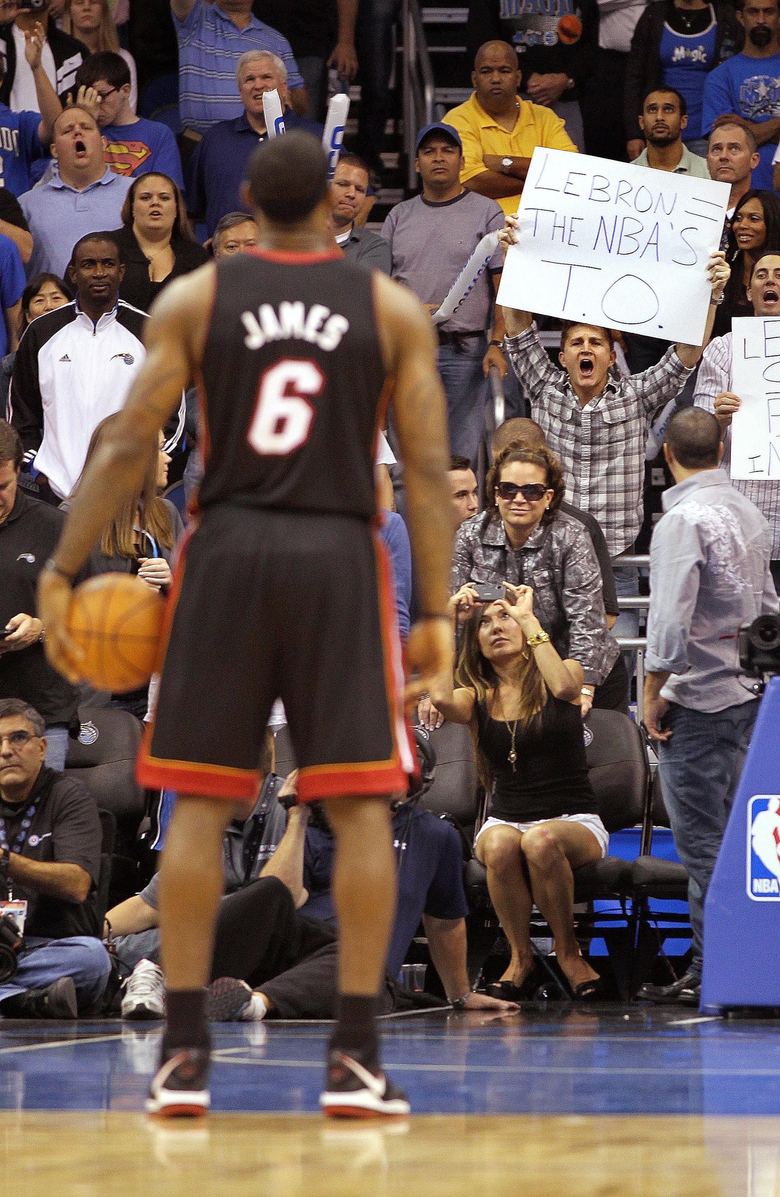 ORLANDO, FL - NOVEMBER 24:  LeBron James #6 of the Miami Heat shoots a foul shot as a fan holds a sign during a game against the Orlando Magic at Amway Arena on November 24, 2010 in Orlando, Florida. NOTE TO USER: User expressly acknowledges and agrees th