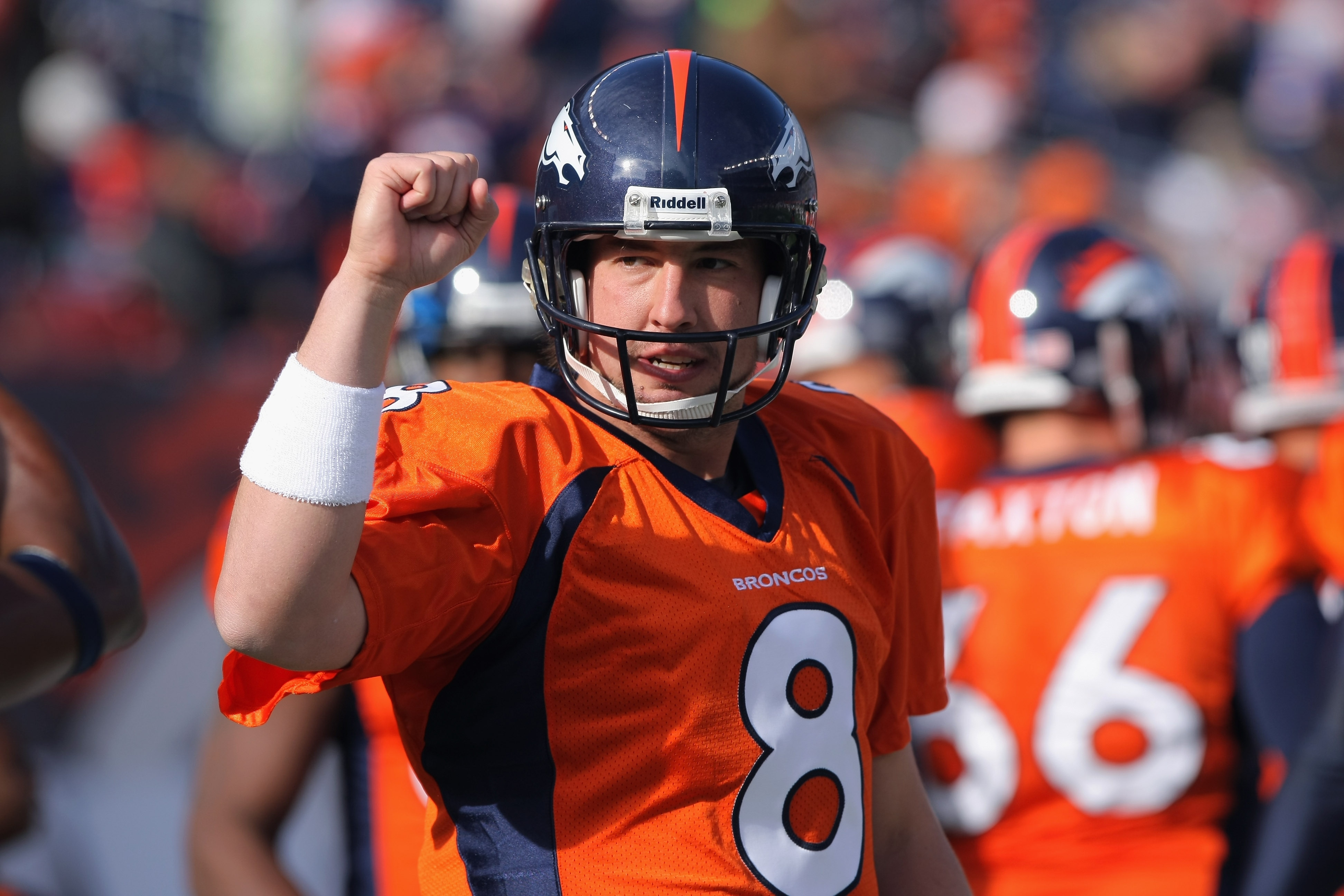 DENVER - NOVEMBER 14:  Quarterback Kyle Orton #8 of the Denver Broncos greets his teammates as they enter the field to face the Kansas City Chiefs at INVESCO Field at Mile High on November 14, 2010 in Denver, Colorado. The Broncos defeated the Chiefs 49-2