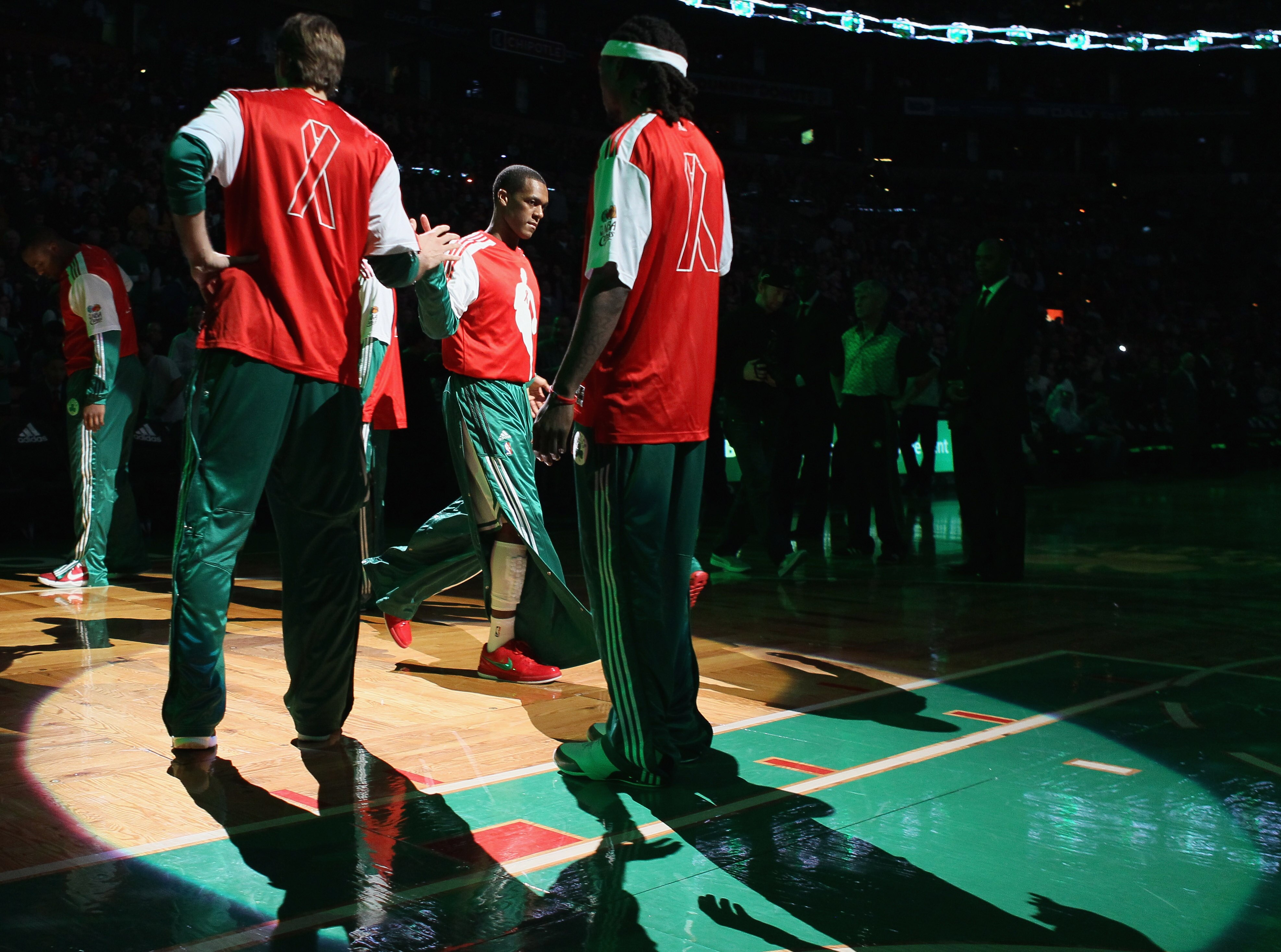 BOSTON - DECEMBER 01:  Rajon Rondo #9 of the Boston Celtics heads out during team introductions before the game against the Portland Trailblazers on December 1, 2010 at the TD Garden in Boston, Massachusetts. NBA players wore special warm up uniforms as p