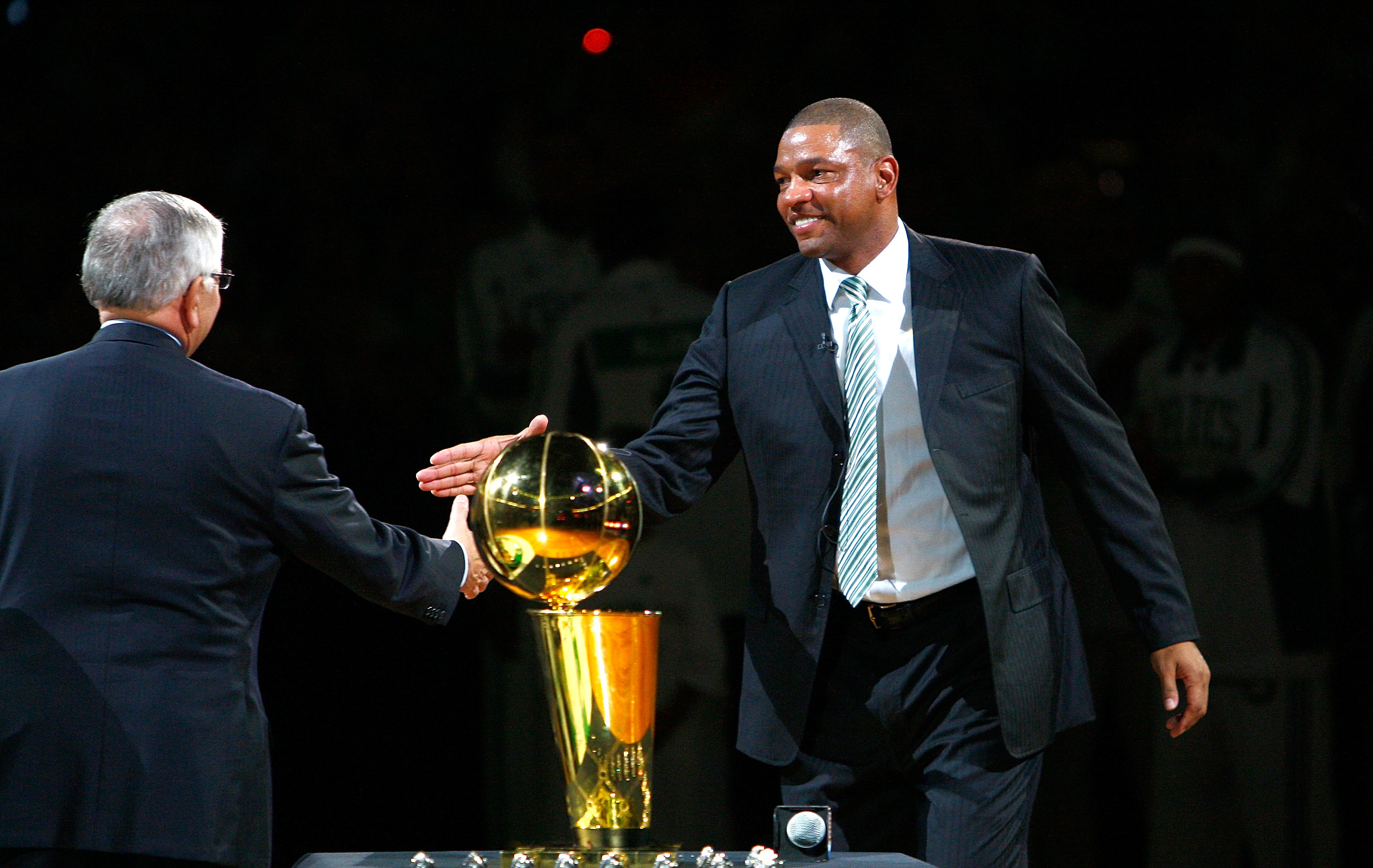 BOSTON, MA - OCTOBER 28: Coach Glenn 'Doc' Rivers of the Boston Celtics shakes hands with NBA Commissioner David Stern during the 2008 NBA World Championship ceremony before a game against the Cleveland Cavaliers at the TD Banknorth Garden on October 28,
