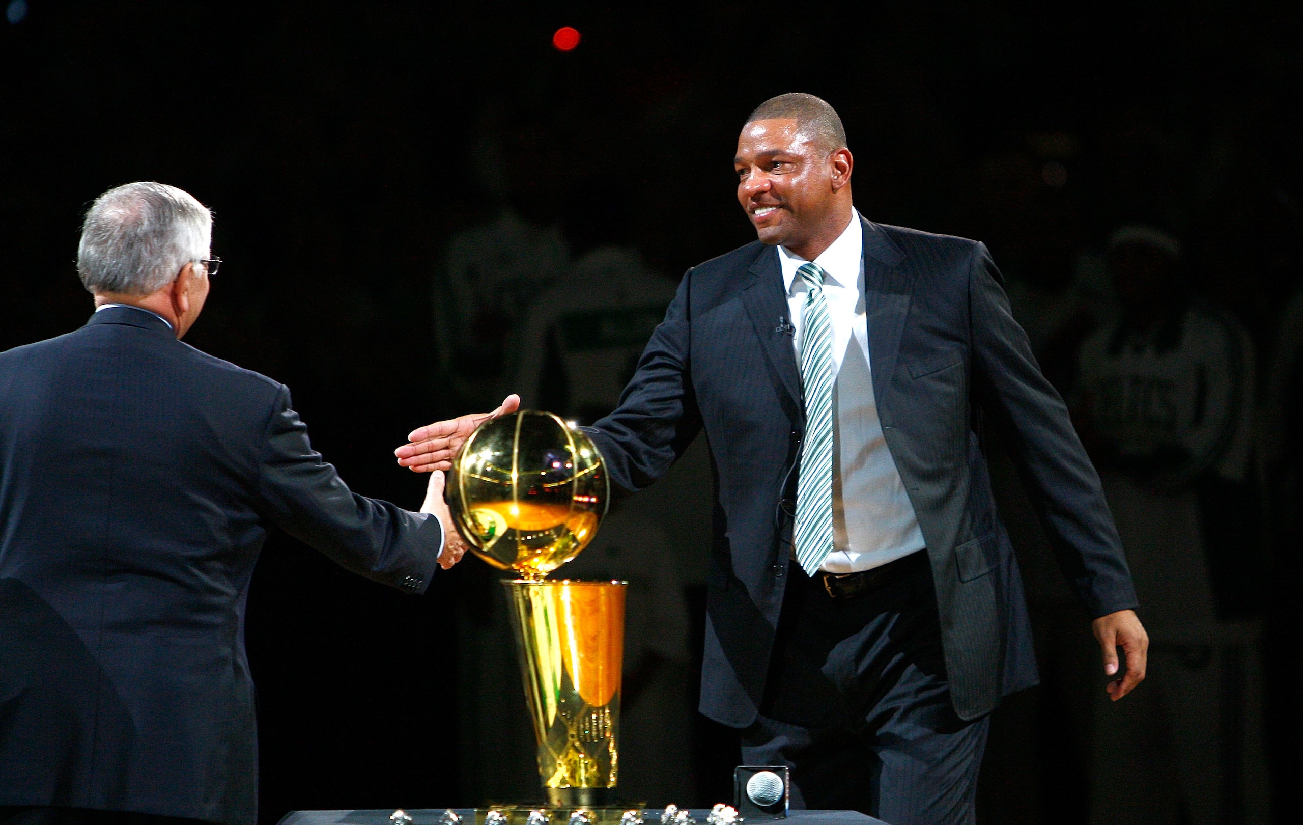 BOSTON, MA - OCTOBER 28: Coach Glenn 'Doc' Rivers of the Boston Celtics shakes hands with NBA Commissioner David Stern during the 2008 NBA World Championship ceremony before a game against the Cleveland Cavaliers at the TD Banknorth Garden on October 28,
