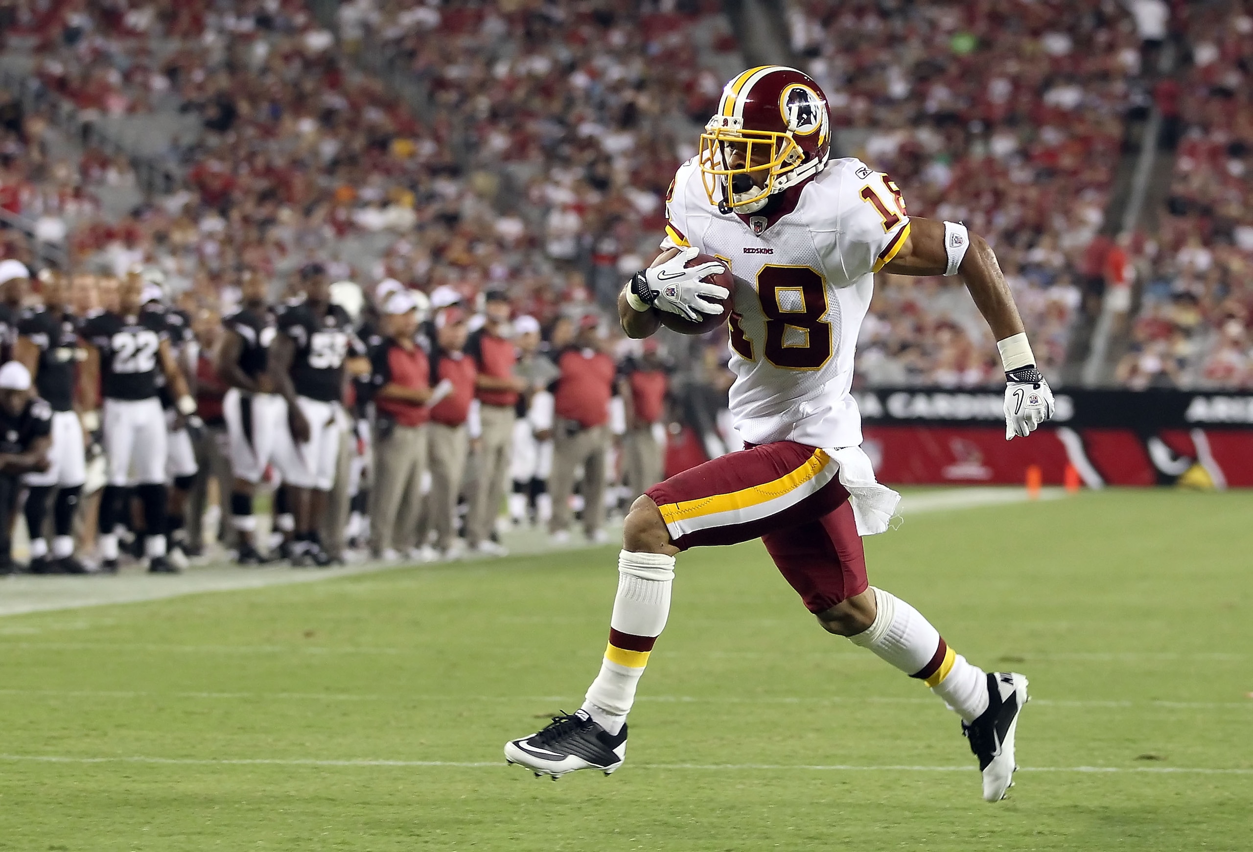 GLENDALE, AZ - SEPTEMBER 02:  Wide receiver Terrence Austin #18 of the Washington Redskins scores a 21 yard touchdown reception against the Arizona Cardinals during the fourth quarter of the preseason NFL game at the University of Phoenix Stadium on Septe