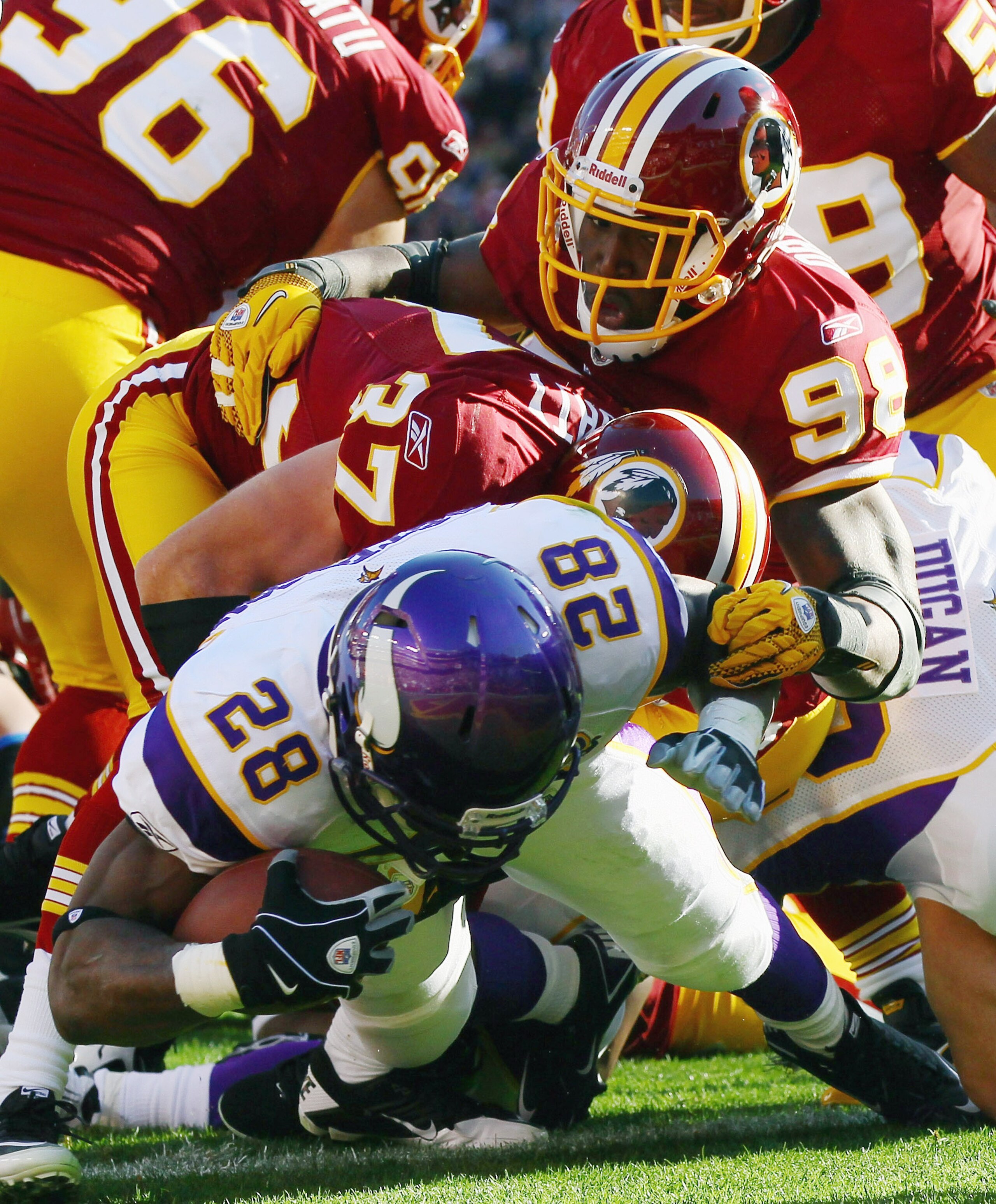 LANDOVER, MD - NOVEMBER 28: Adrian Peterson #28 of the Minnesota Vikings scores a touchdown in the first quarter against the Washington Redskins at FedExField November 28, 2010 in Landover, Maryland. (Photo by Win McNamee/Getty Images)
