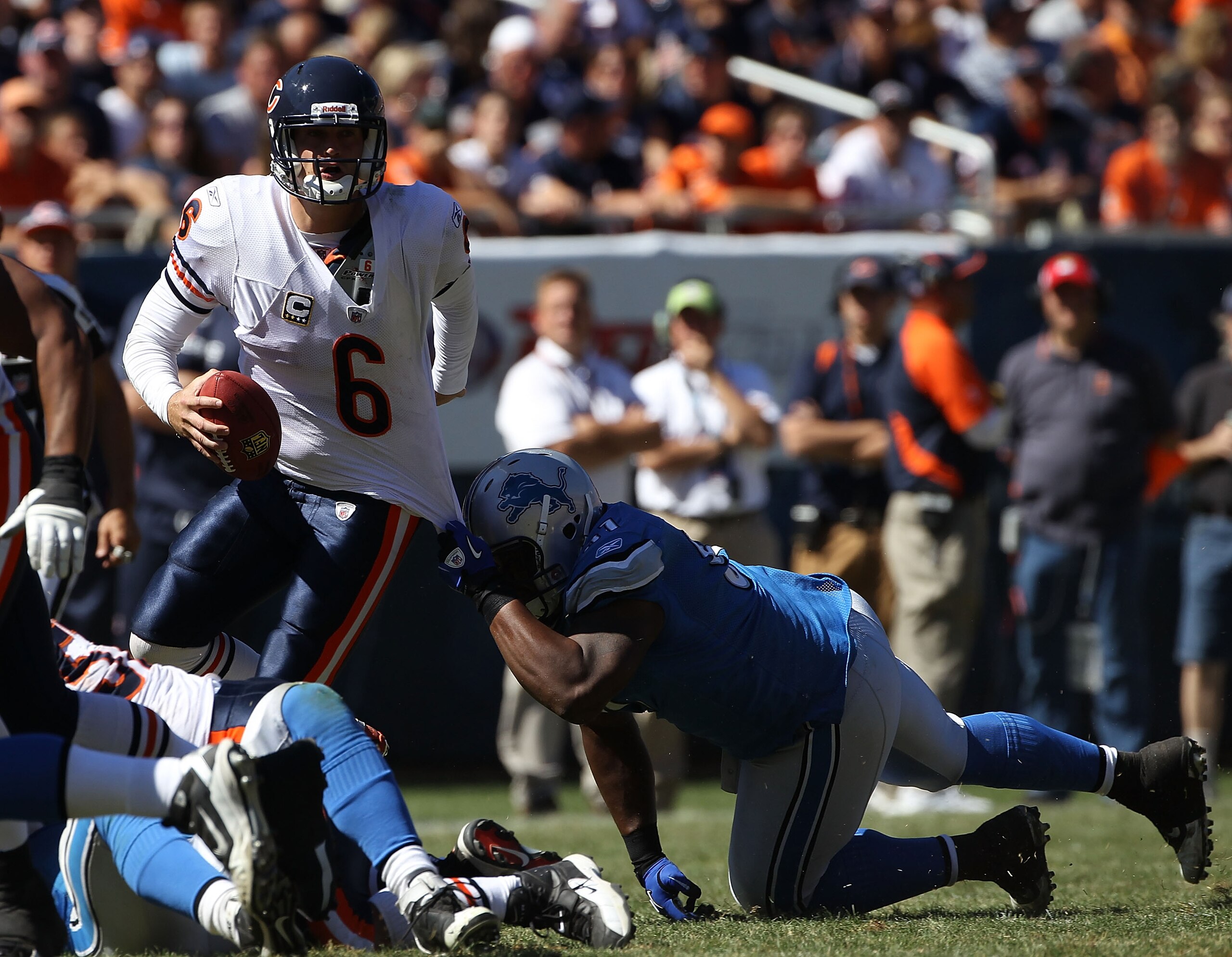 CHICAGO - SEPTEMBER 12: Sammie Hill #91 of the Detroit Lions grabs the jersey of Jay Cutler #6 of the Chicago Bears during the NFL season opening game at Soldier Field on September 12, 2010 in Chicago, Illinois. The Bears defeated the Lions 19-14. (Photo 