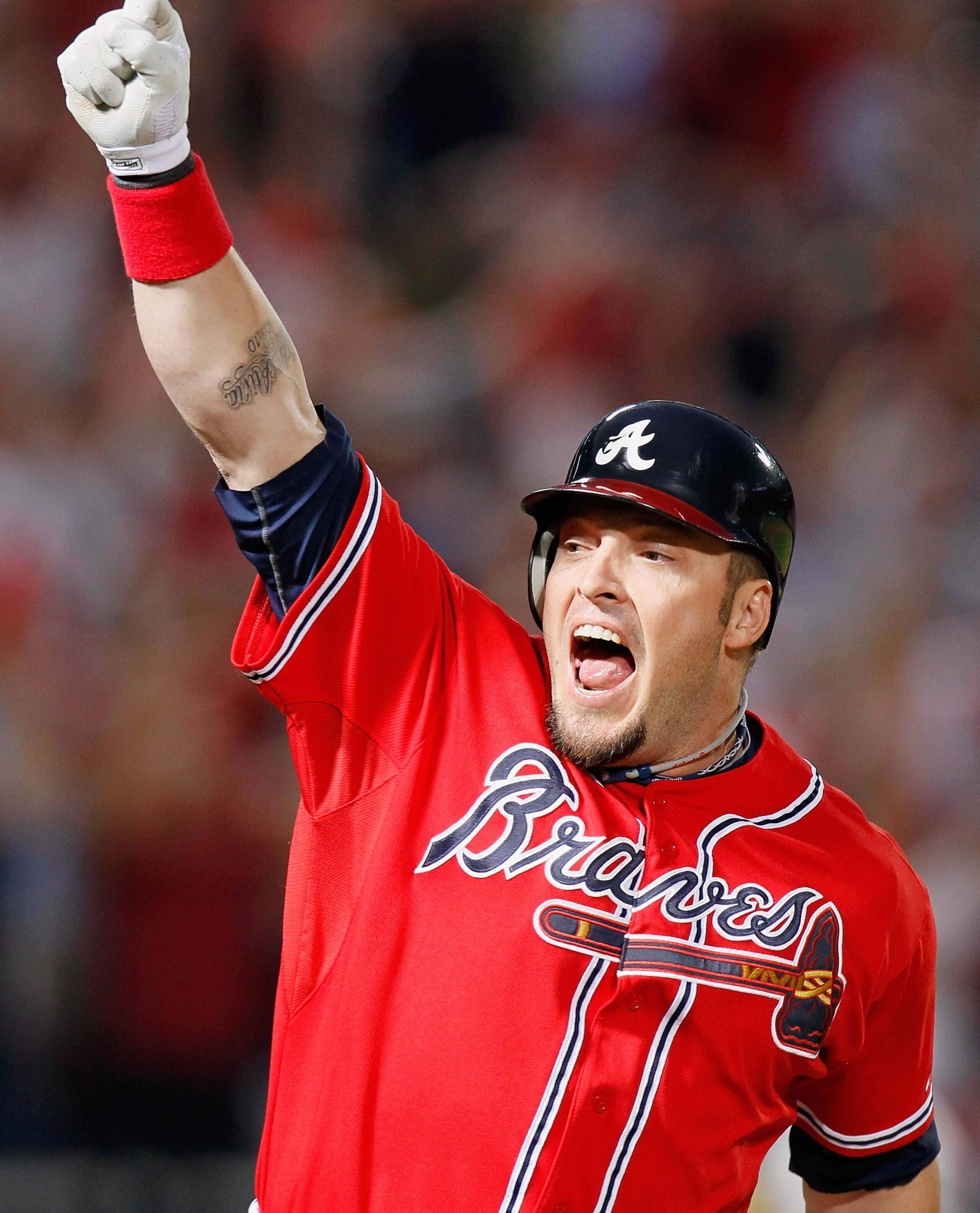 ATLANTA - OCTOBER 10:  Eric Hinske #20 of the Atlanta Braves reacts after hitting a two-run homer in the eighth inning off pitcher Sergio Romo #54 of the San Francisco Giants during Game Three of the NLDS of the 2010 MLB Playoffs at Turner Field on Octobe