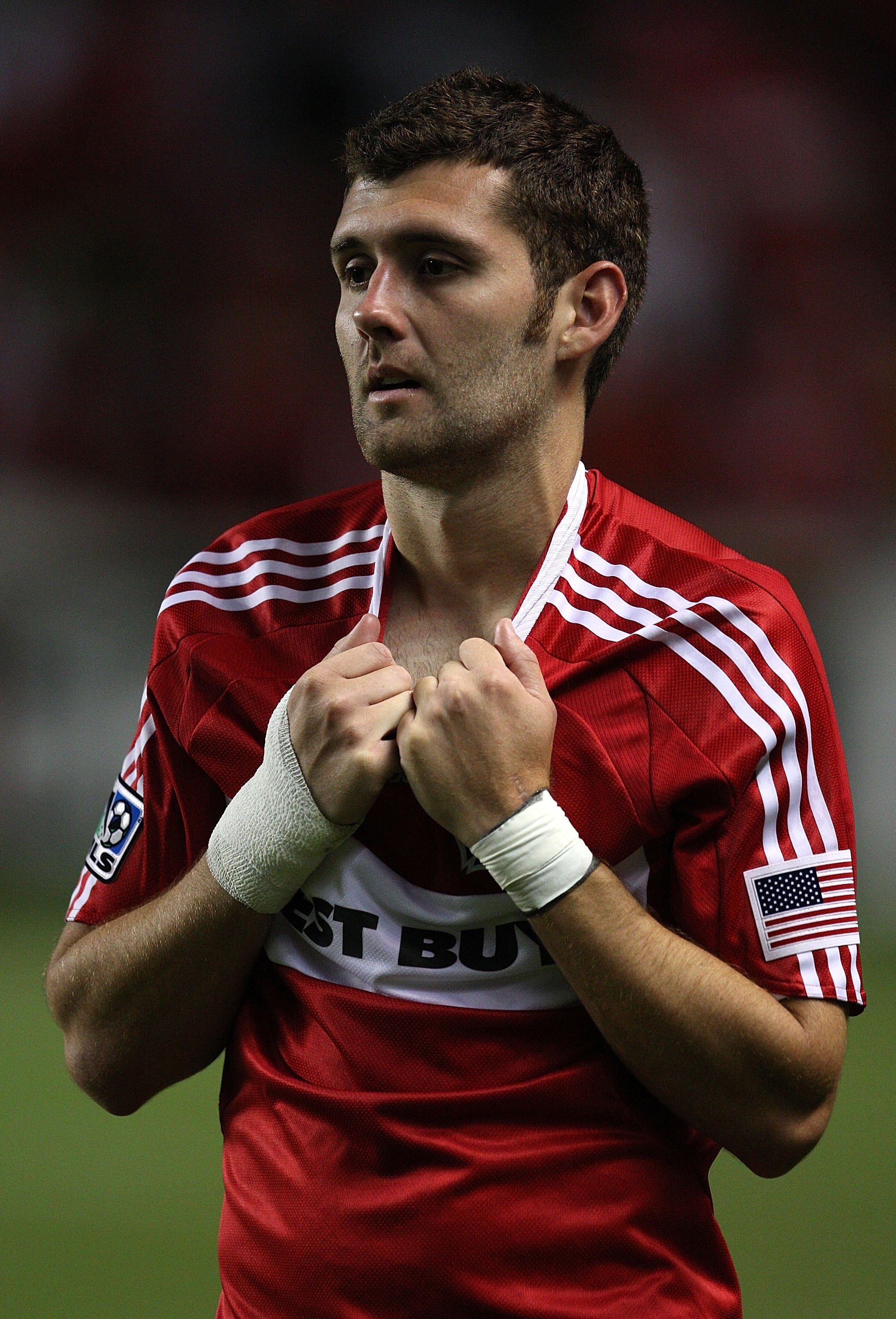 BRIDGEVIEW, IL - AUGUST 05: Gonzalo Segares #25 of the Chicago Fire watches as members of Tigres UANL celebrate winning the SuperLiga 2009 Final on August 5, 2009 at Toyota Park in Bridgeview, Illinois. Tigres UANL defeated the Fire 1-1 (4-3) in a shoot o