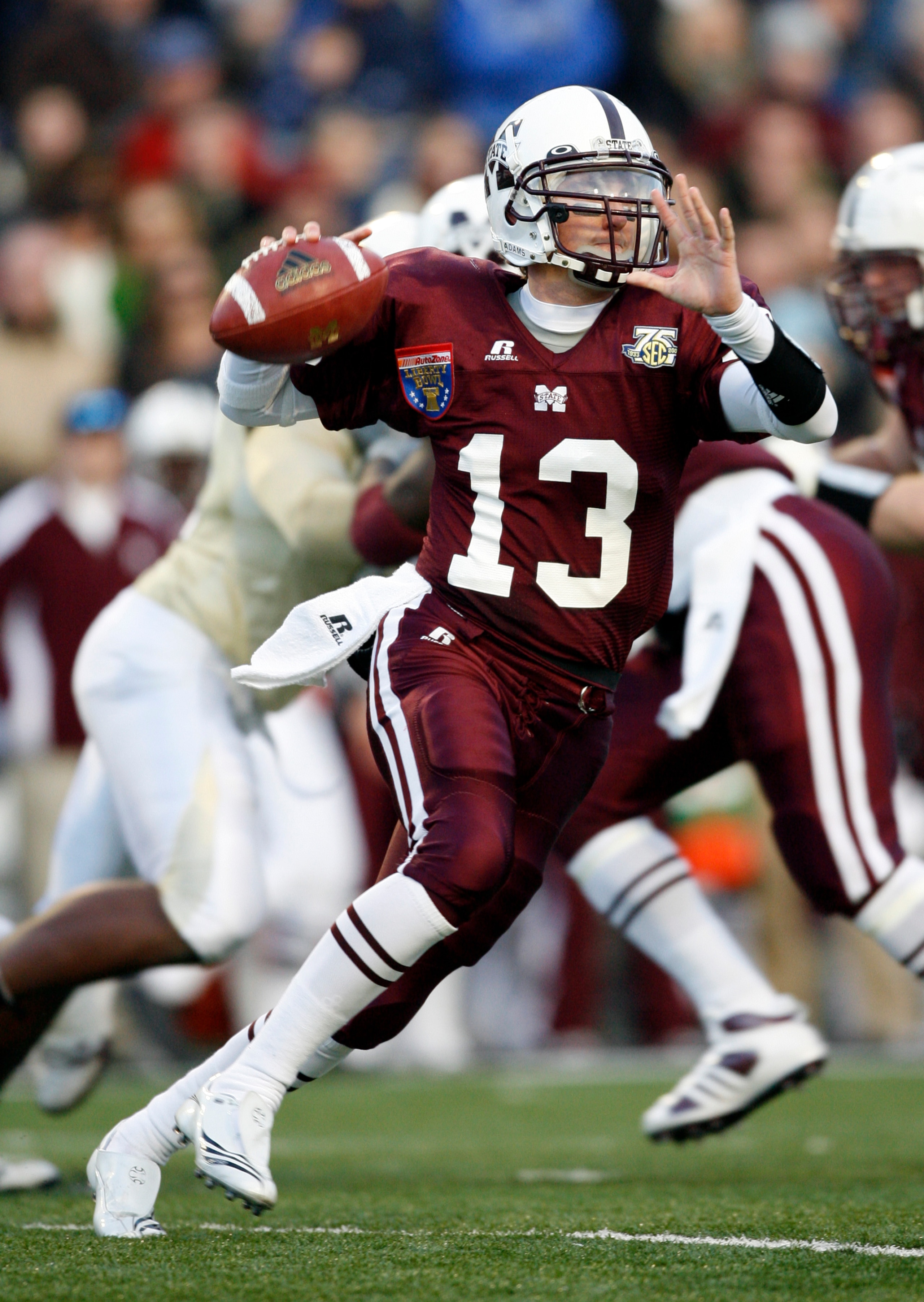 MEMPHIS, TN - DECEMBER 29:  Wesley Carroll #13 of the Mississippi State Bulldogs looks to throw downfield against the UCF Knights during the 49th Annual Autozone Liberty Bowl at Liberty Bowl Memorial Stadium December 29, 2007 in Memphis, Tennessee.  (Phot