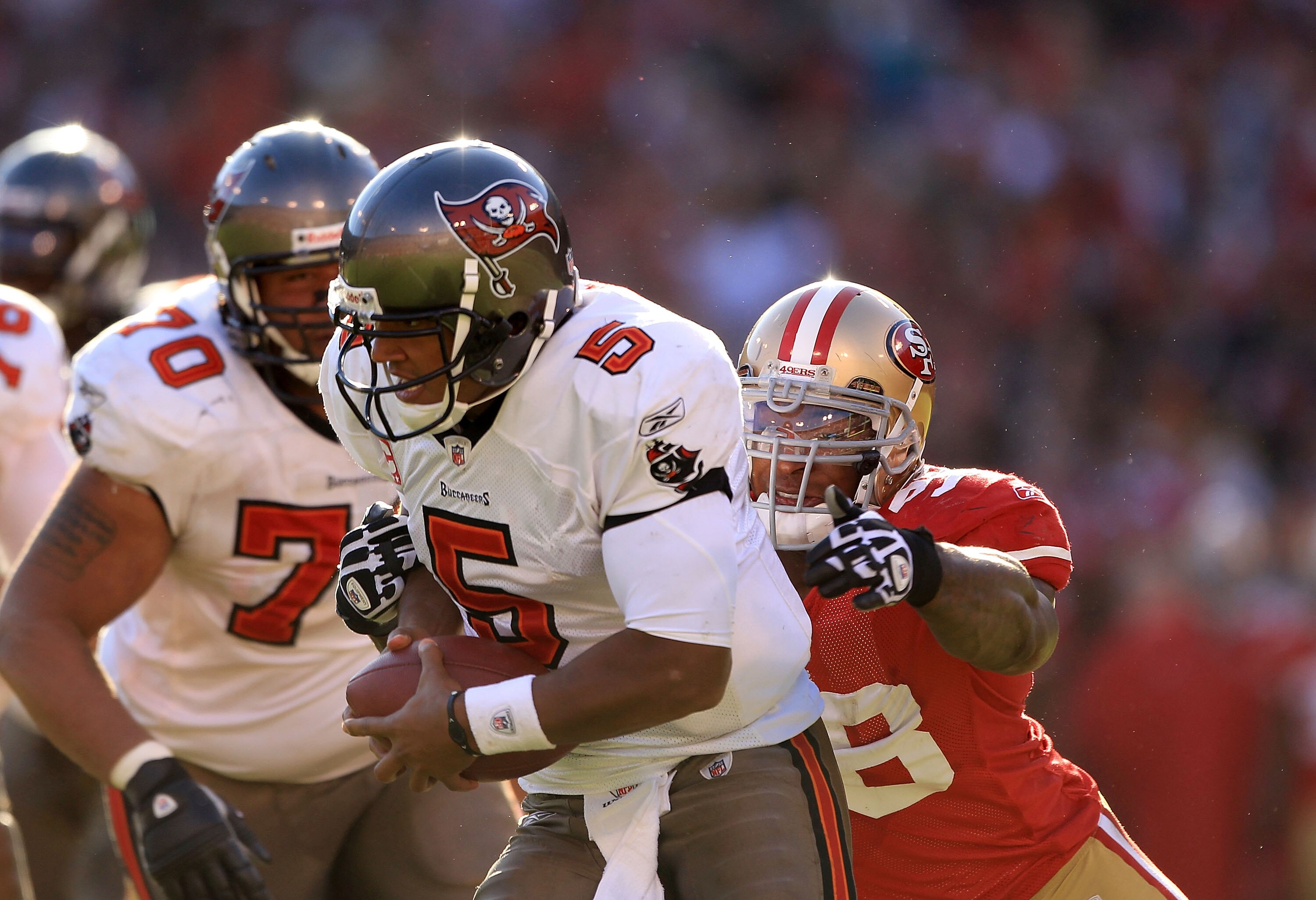 SAN FRANCISCO - NOVEMBER 21:  Josh Freeman #5 of the Tampa Bay Buccaneers is tackled by Parys Haralson #98 of the San Francisco 49ers at Candlestick Park on November 21, 2010 in San Francisco, California.  (Photo by Ezra Shaw/Getty Images)
