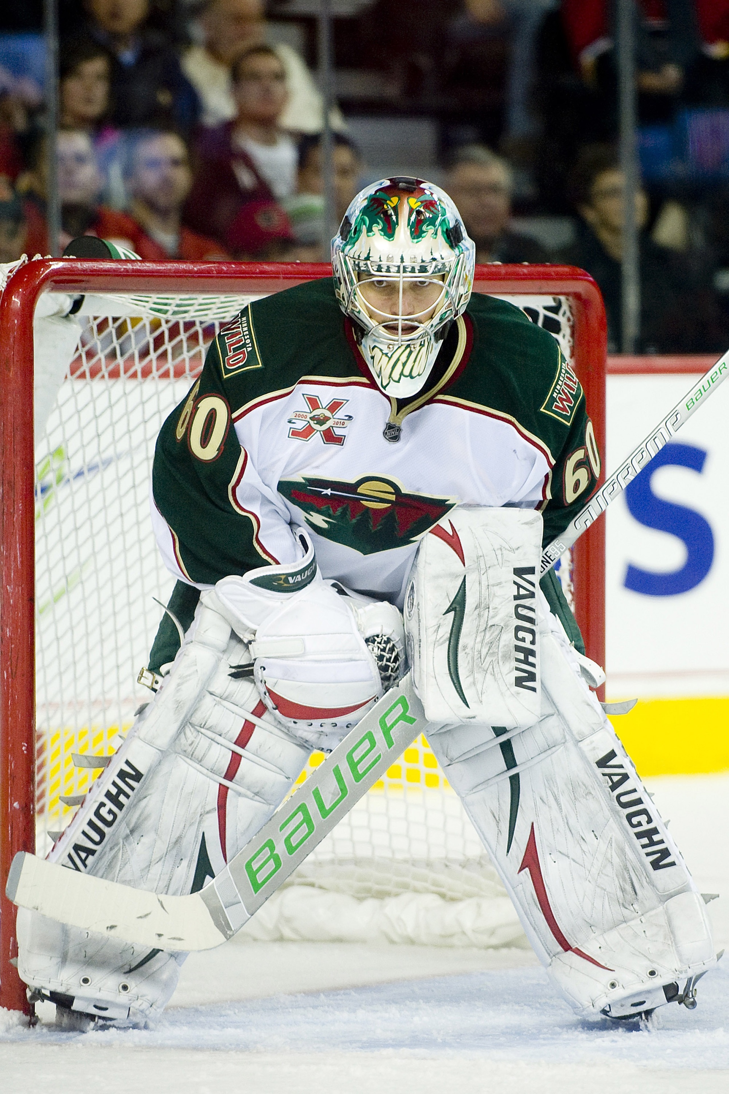 EDMONTON, AB - NOVEMBER 29:  Jose Theodore #60 of the Minnesota Wild concentrates on the puck against the Calgary Flames at Scotiabank Saddledome on November 29, 2010 in Calgary, Alberta, Canada. The Flames beat the Wild 3-0.  (Photo by Dylan Lynch/Getty