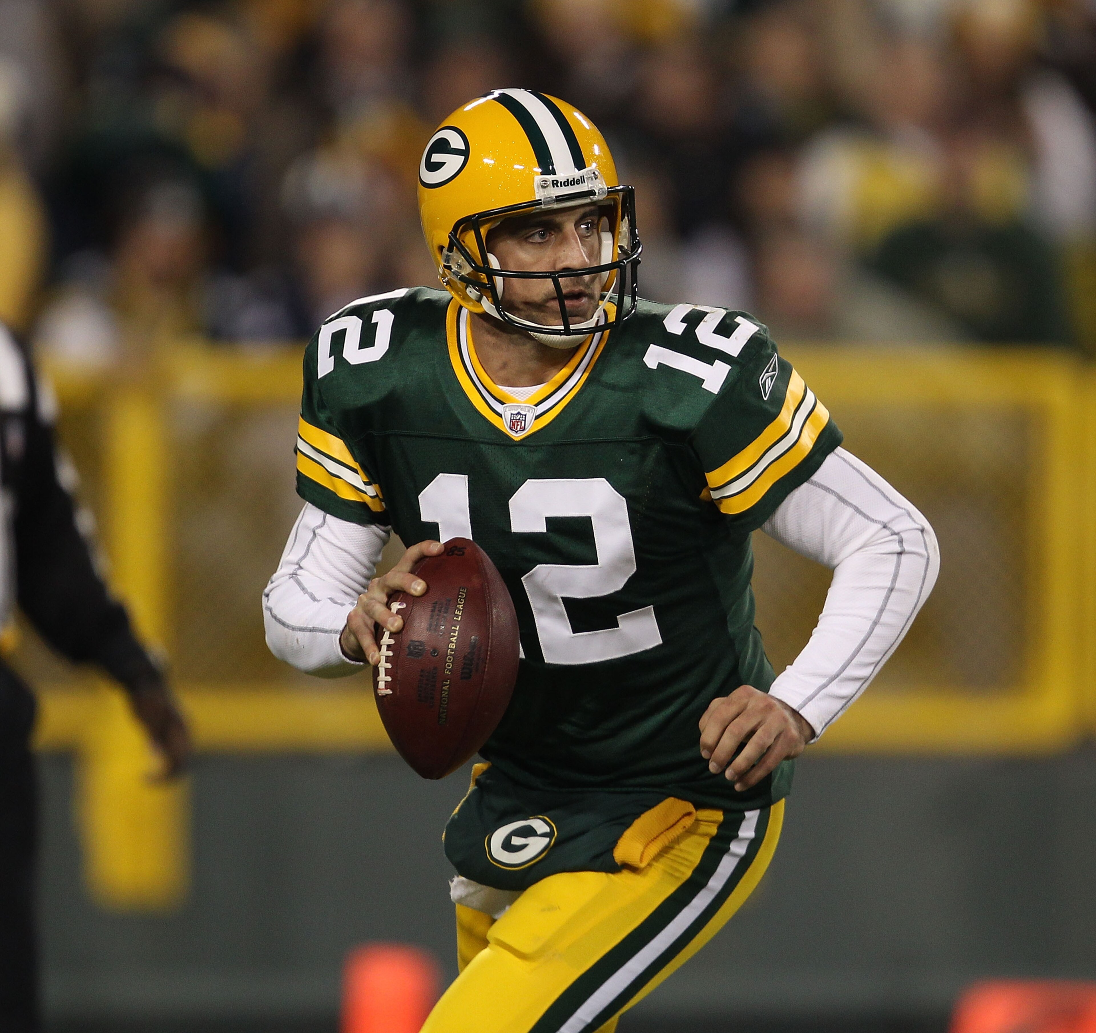 GREEN BAY, WI - NOVEMBER 07: Aaron Rodgers #12 of the Green Bay Packers looks for a receiver against the Dallas Cowboys at Lambeau Field on November 7, 2010 in Green Bay, Wisconsin. The Packers defeated the Cowboys 45-7. (Photo by Jonathan Daniel/Getty Im