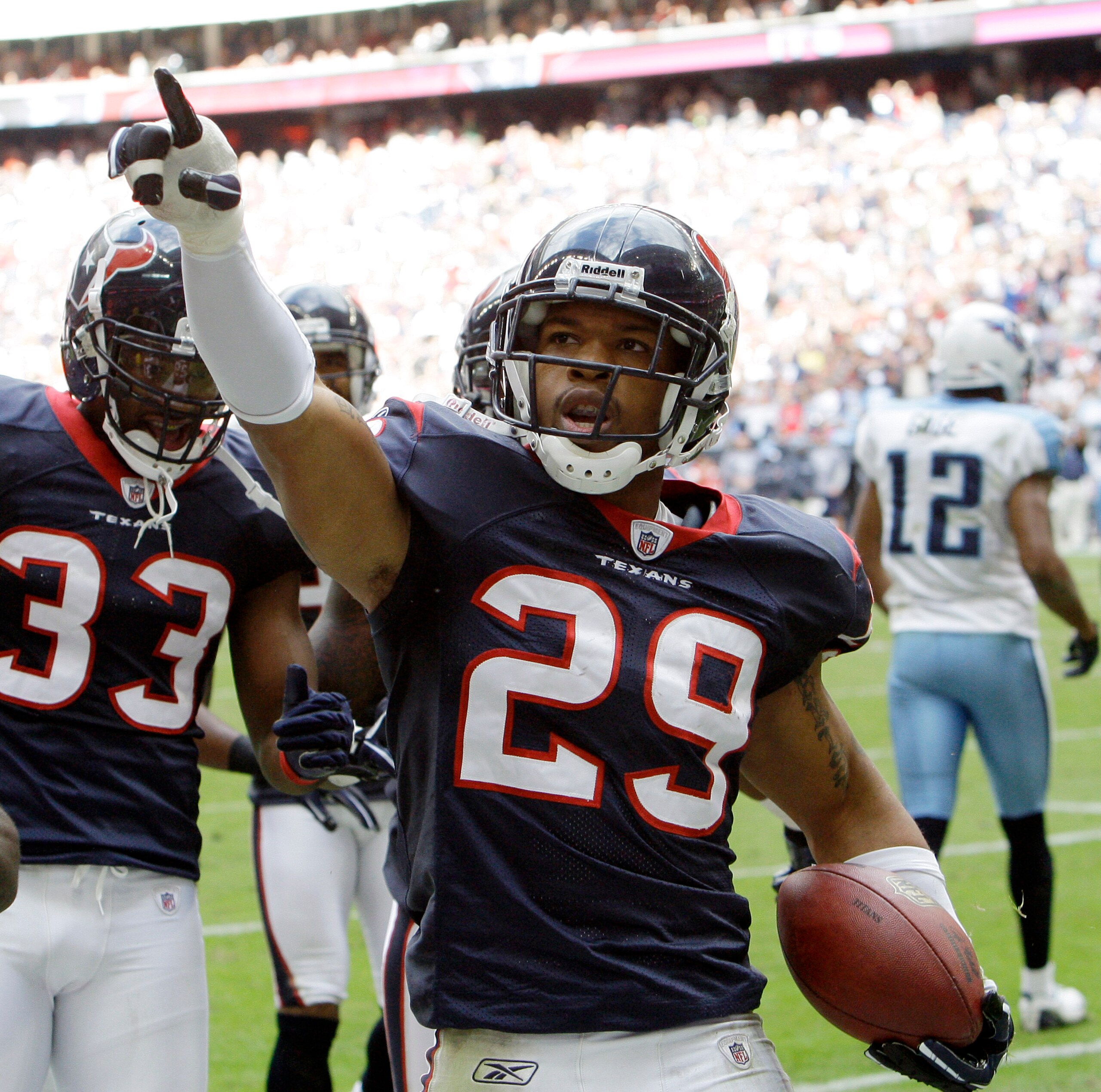 HOUSTON - NOVEMBER 28:  Cornerback Glover Quin #29 of the Houston Texans celebrates after intercepting a pass intended for wide receiver Justin Gage #12 of the Tennessee Titans at Reliant Stadium on November 28, 2010 in Houston, Texas.  (Photo by Bob Leve
