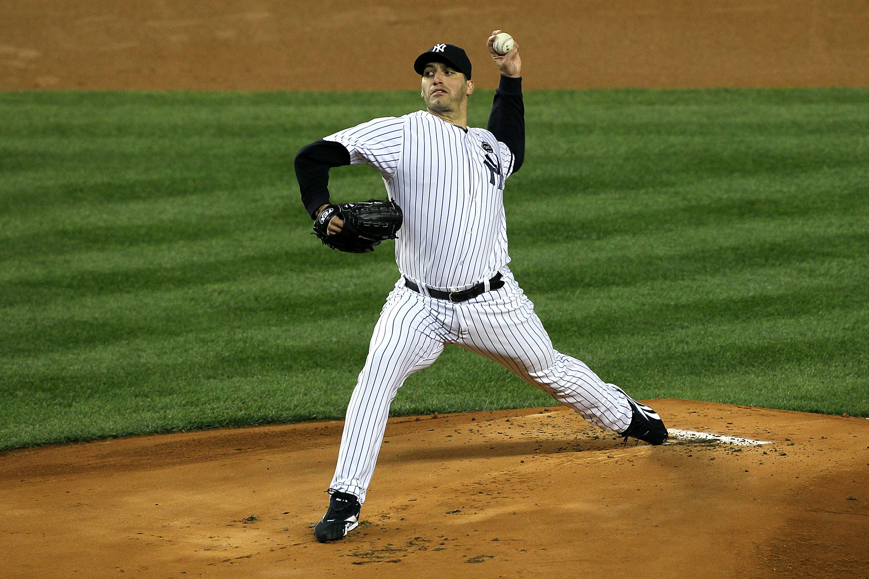 NEW YORK - OCTOBER 18:  Starting pitcher Andy Pettitte #46 of the New York Yankees pitches against the Texas Rangers in Game Three of the ALCS during the 2010 MLB Playoffs at Yankee Stadium on October 18, 2010 in New York, New York.  (Photo by Jim McIsaac