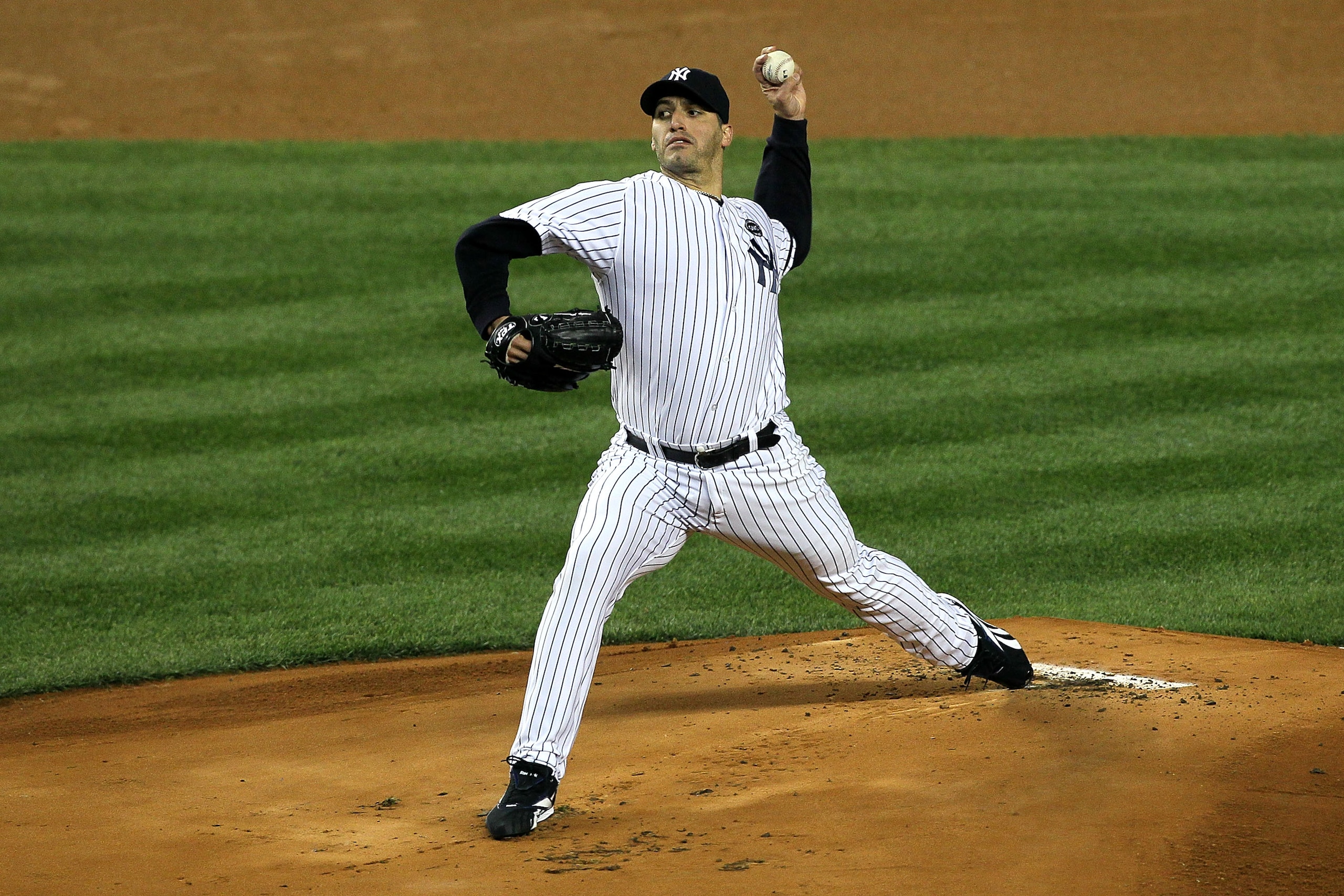 NEW YORK - OCTOBER 18:  Starting pitcher Andy Pettitte #46 of the New York Yankees pitches against the Texas Rangers in Game Three of the ALCS during the 2010 MLB Playoffs at Yankee Stadium on October 18, 2010 in New York, New York.  (Photo by Jim McIsaac