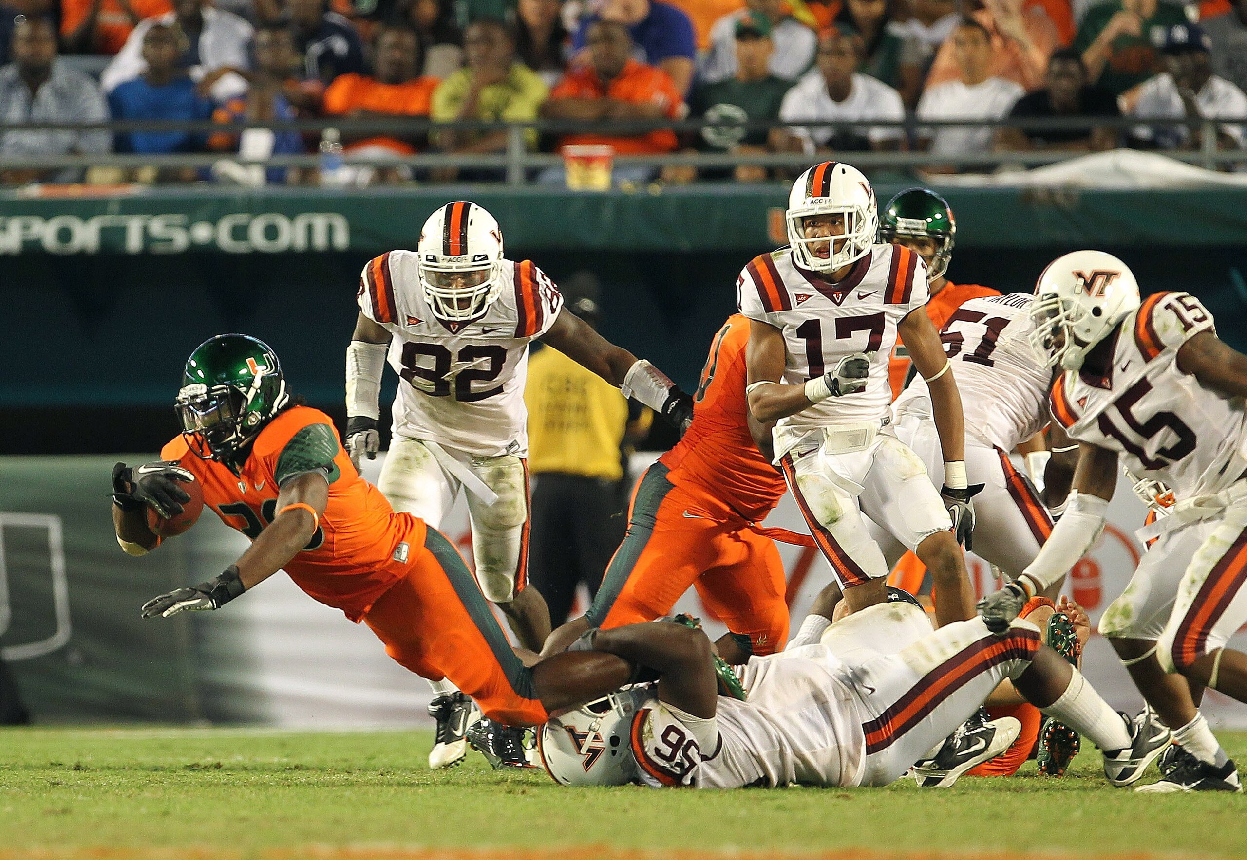 MIAMI - NOVEMBER 20: Patrick Hill #30 of the Miami Hurricanes is tackled after a run by Antoine Hopkins #56 of the Virginia Tech Hokies at Sun Life Stadium on November 20, 2010 in Miami, Florida.  (Photo by Mike Ehrmann/Getty Images)