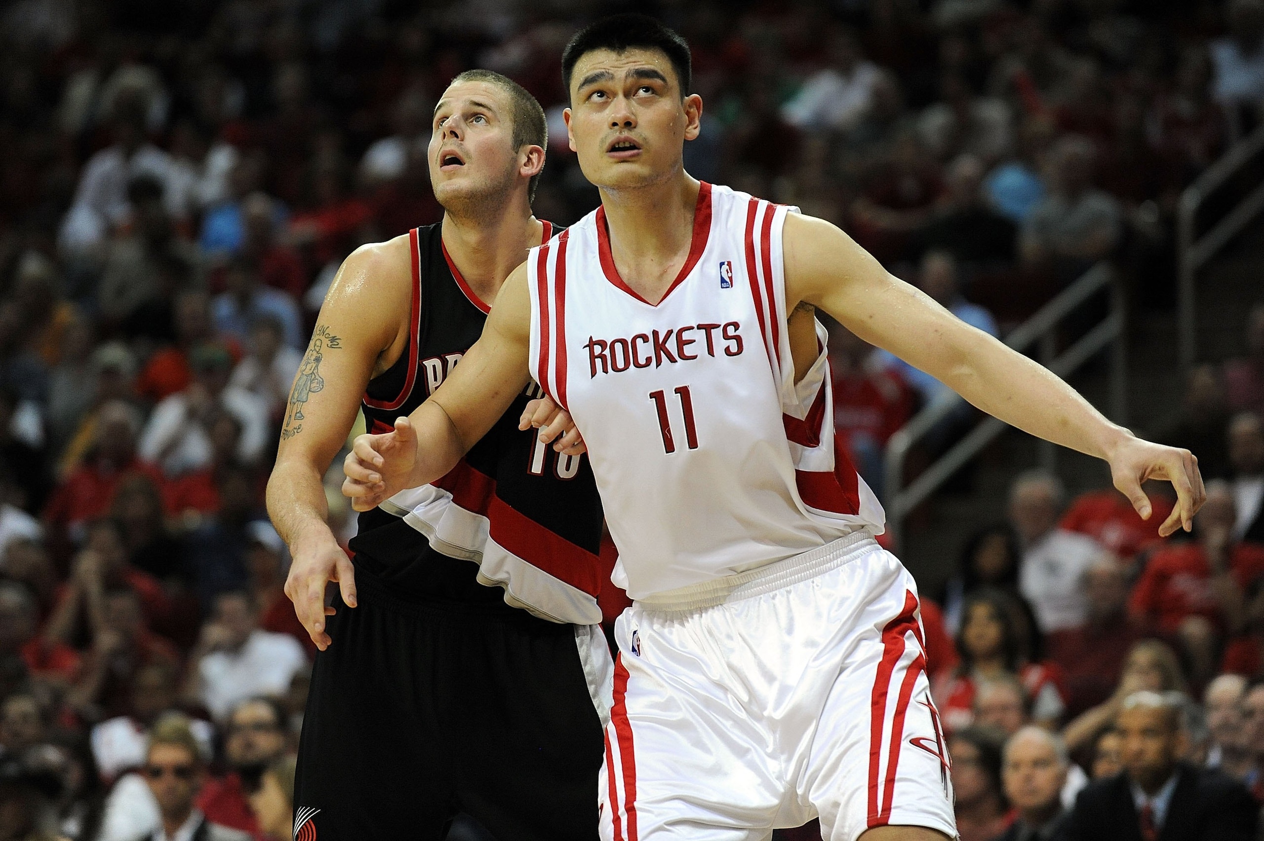 HOUSTON - APRIL 26:  Center Joel Przybilla #10 of the Portland Trail Blazers and Yao Ming #11 of the Houston Rockets in Game Four of the Western Conference Quarterfinals during the 2009 NBA Playoffs at Toyota Center on April 26, 2009 in Houston, Texas. NO