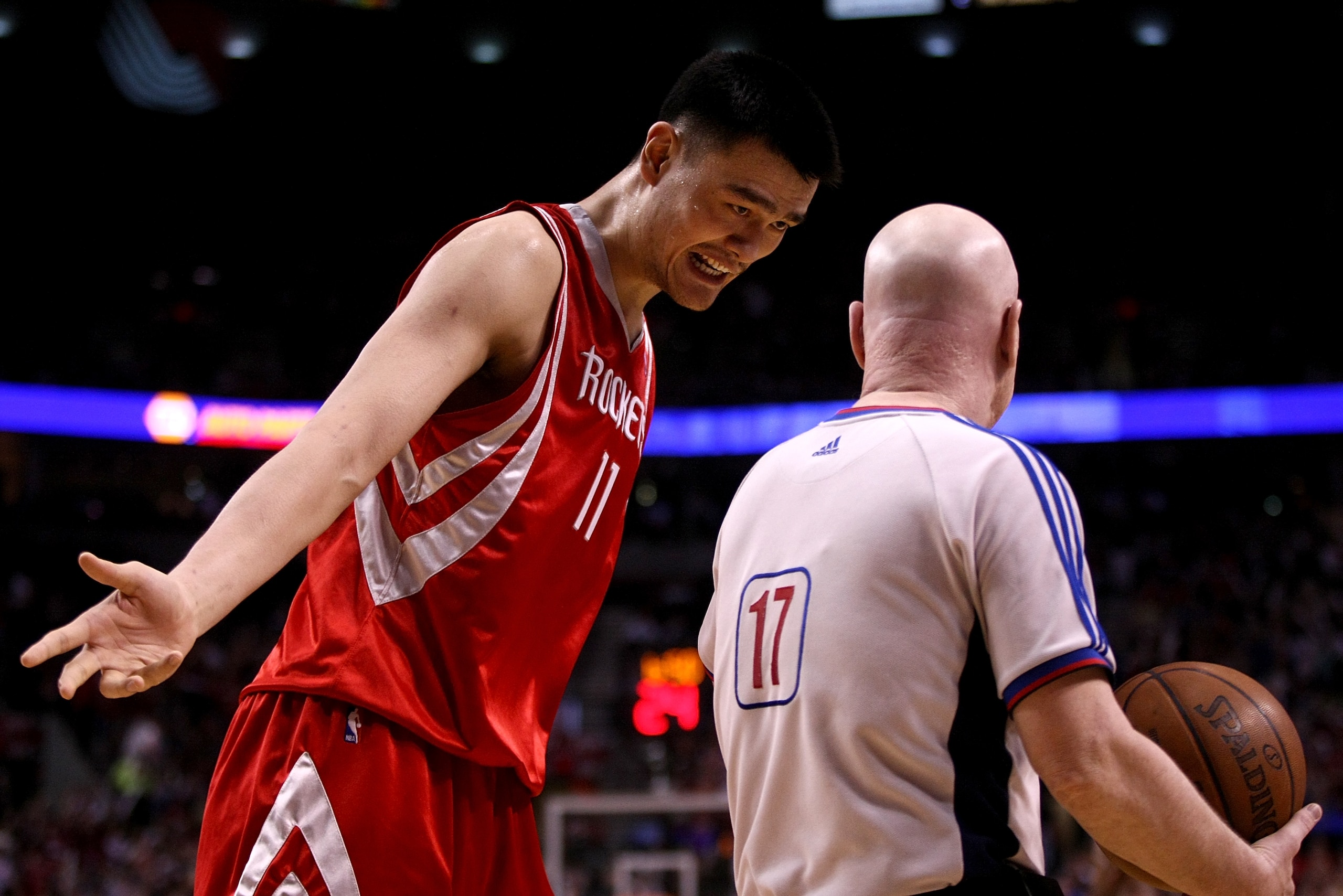 PORTLAND, OR - APRIL 21:  Yao Ming #11 of the Houston Rockets argues a call with referee Joe Crawford during Game 2 of the Western Conference Quarterfinals against the Portland Trail Blazers during the 2009 NBA Playoffs at the Rose Garden on April 21, 200